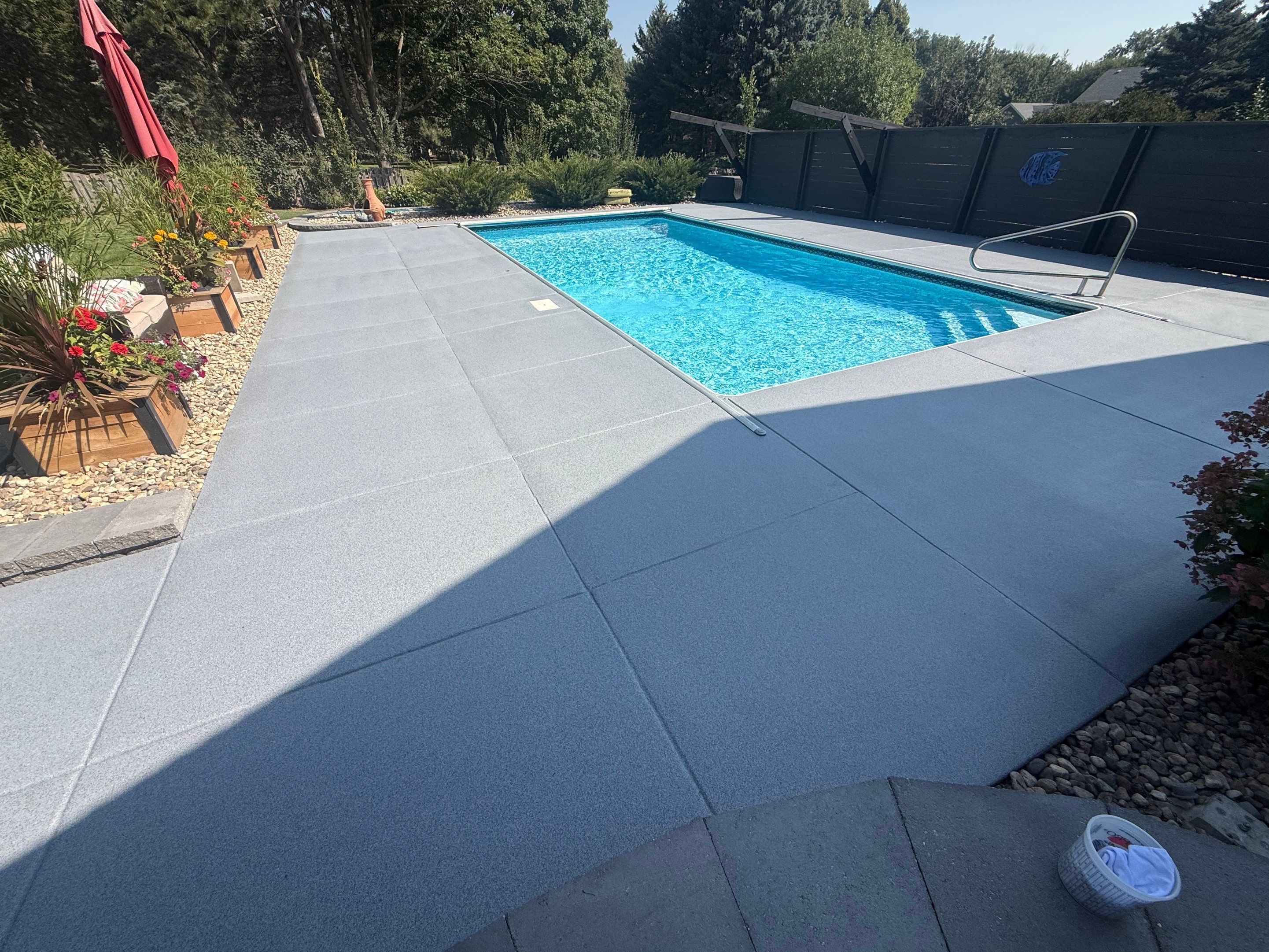 Garage Floor and Textured Pool Deck Coating in Sioux Falls by Select Painting, Coatings & Garage Cabinets