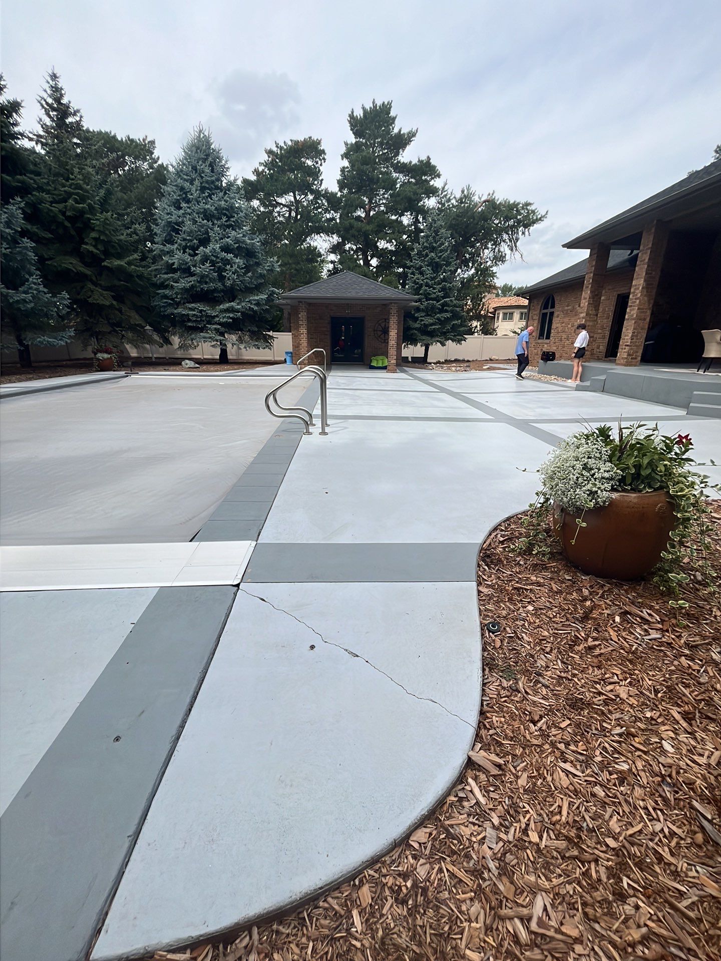 Decorative Concrete Pool Deck and Patio Resurfacing in Sioux Falls by Select Painting, Coatings & Garage Cabinets
