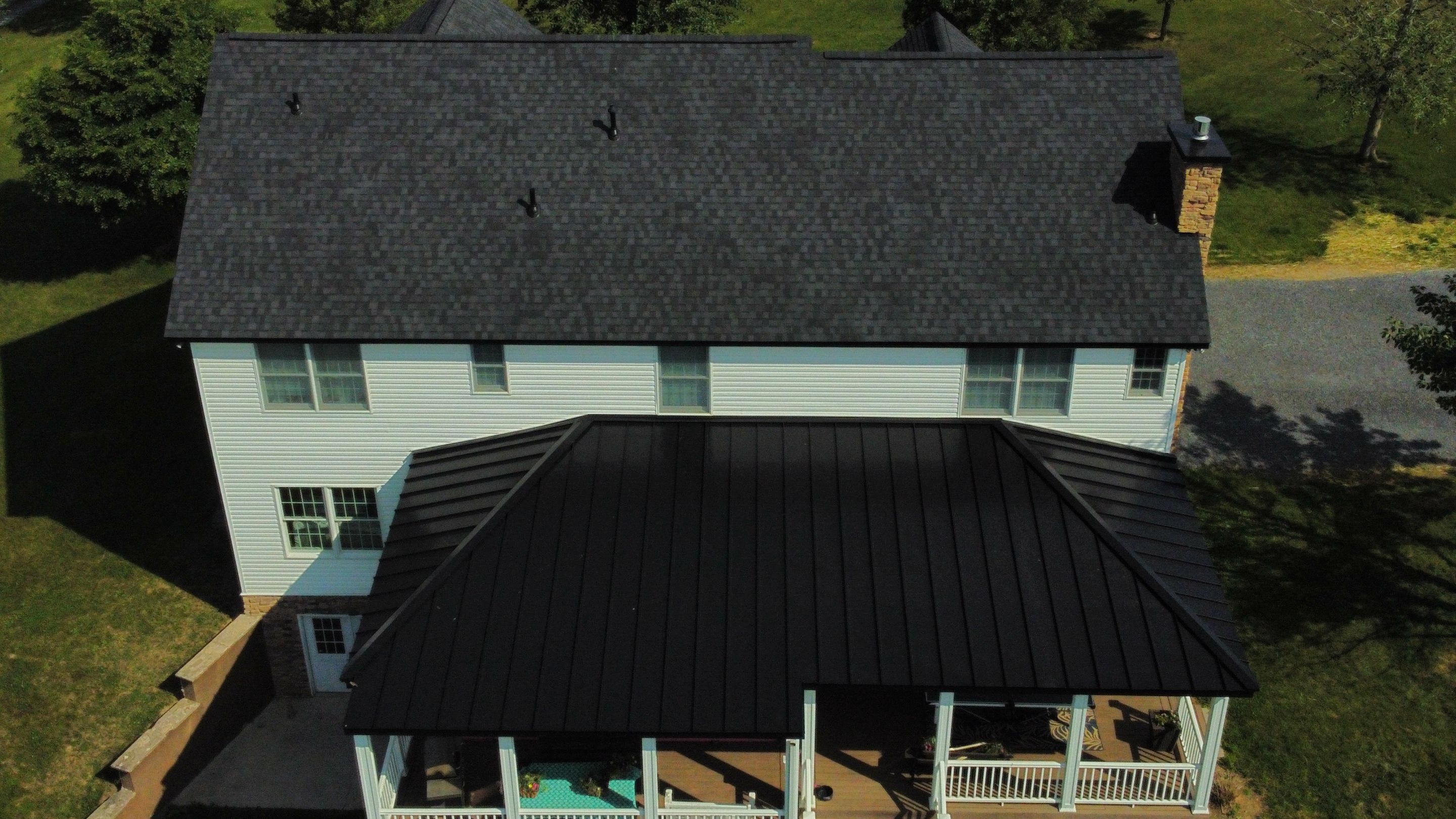 Roof Damage using Certainteed Lifetime Roofing System- Moire Black Landmark Pro shingkes with shadow ridge caps. by BulletpROOF Exteriors