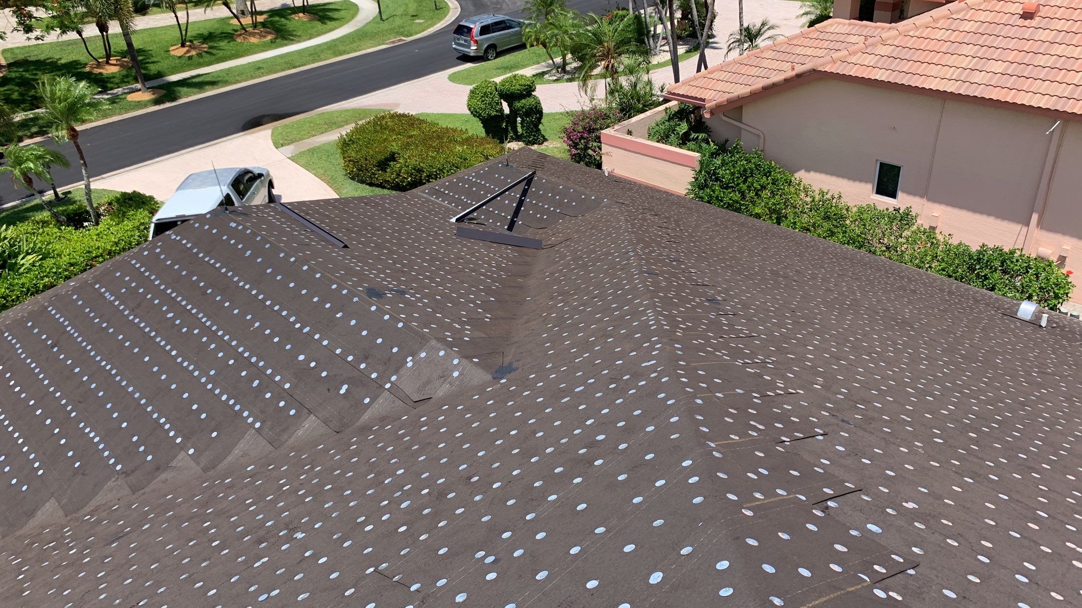 Residential Roofing Installation using 1" Nail strip metal roof by BLUES BROTHERS CONSTRUCTION CORP