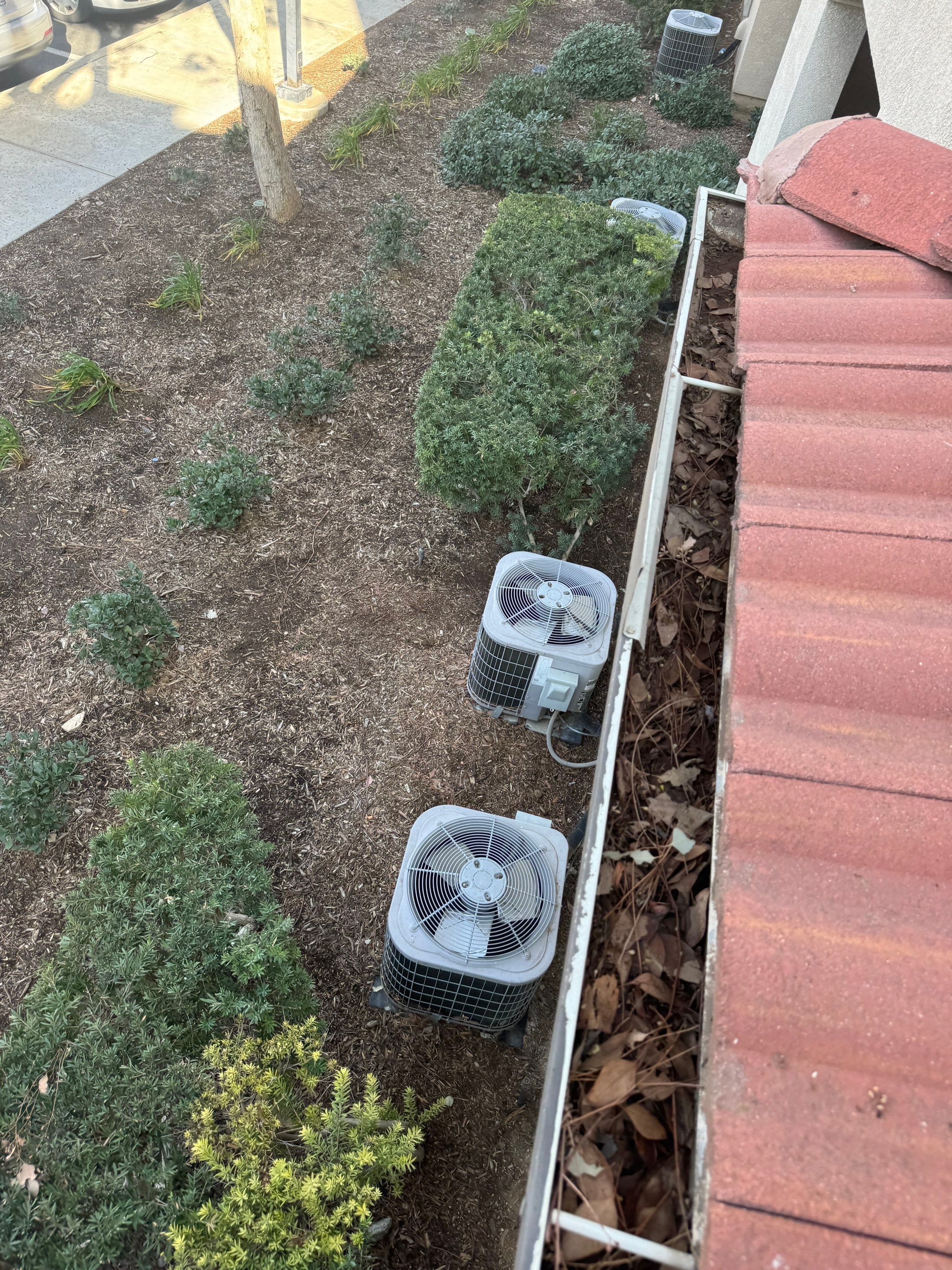 Commercial gutter cleaning Riverside, CA before photo with filled gutters