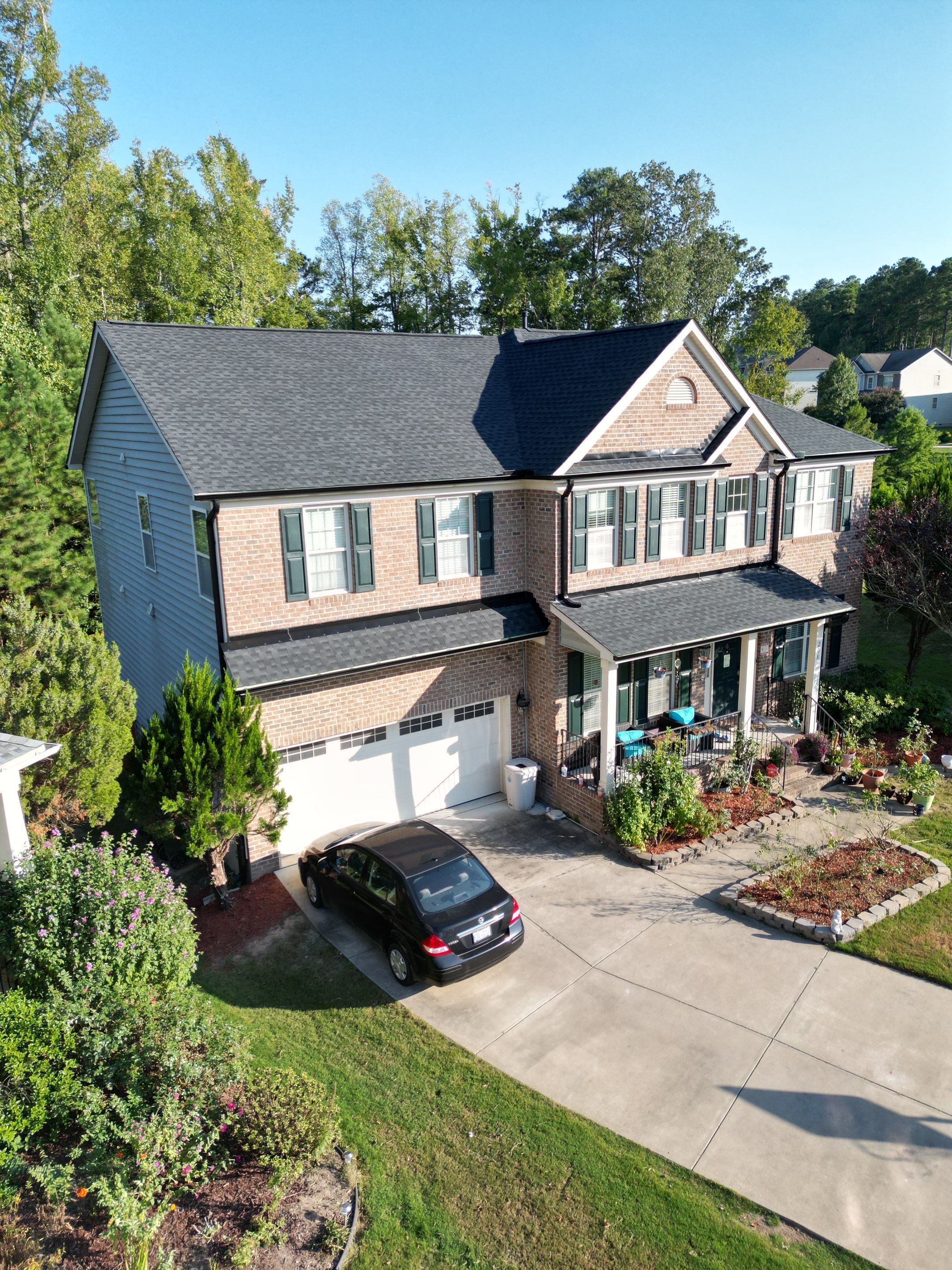 Roof Replacment - GAF Timberline HDZ Charcoal with 5” black seamless gutters  by Pro Performance Roofing