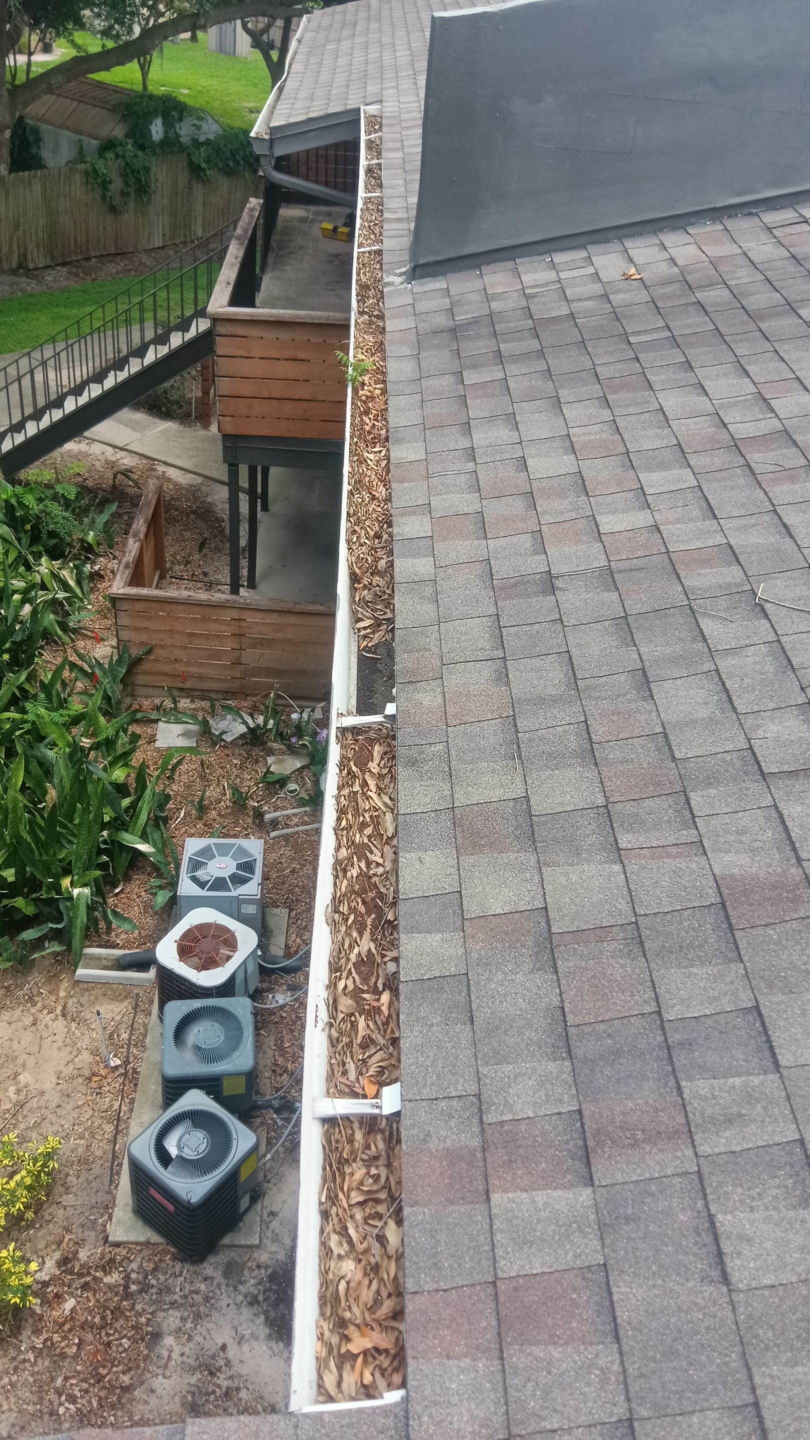 Commercial gutter cleaning Lakeland before photo with filled gutters