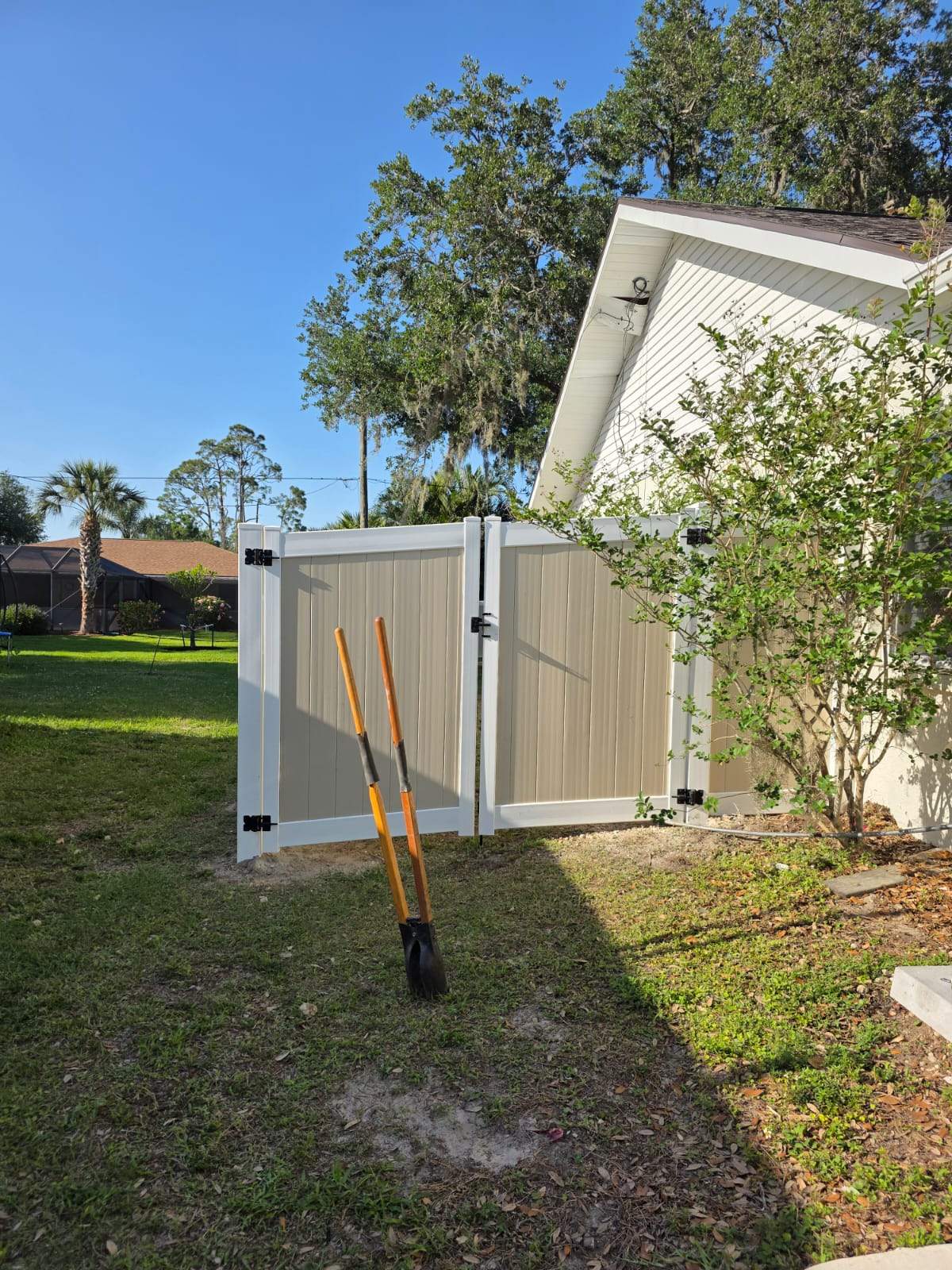 Two-Tone Vinyl Privacy Fence Installation in Port Charlotte by True Fence LLC