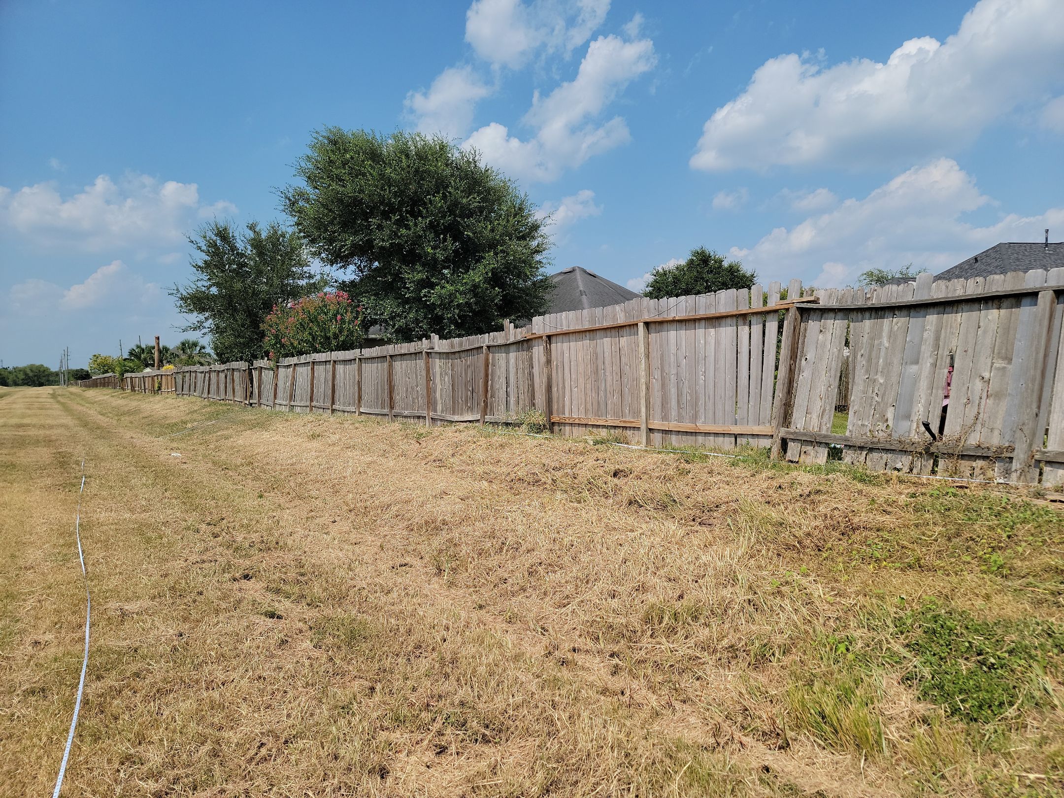 Beautiful Wood fence with metal posts by Tim's Fences