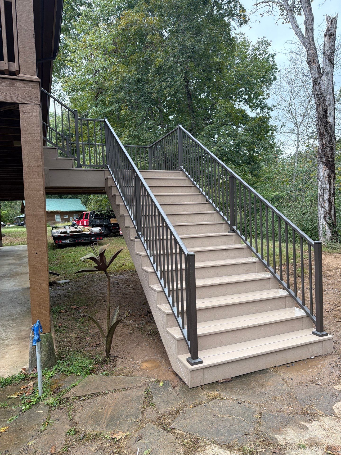 Log Cabin Wrap-Around Deck and External Staircase Installation in Caldwell by Walnut Hollow Decks & Outdoor Living