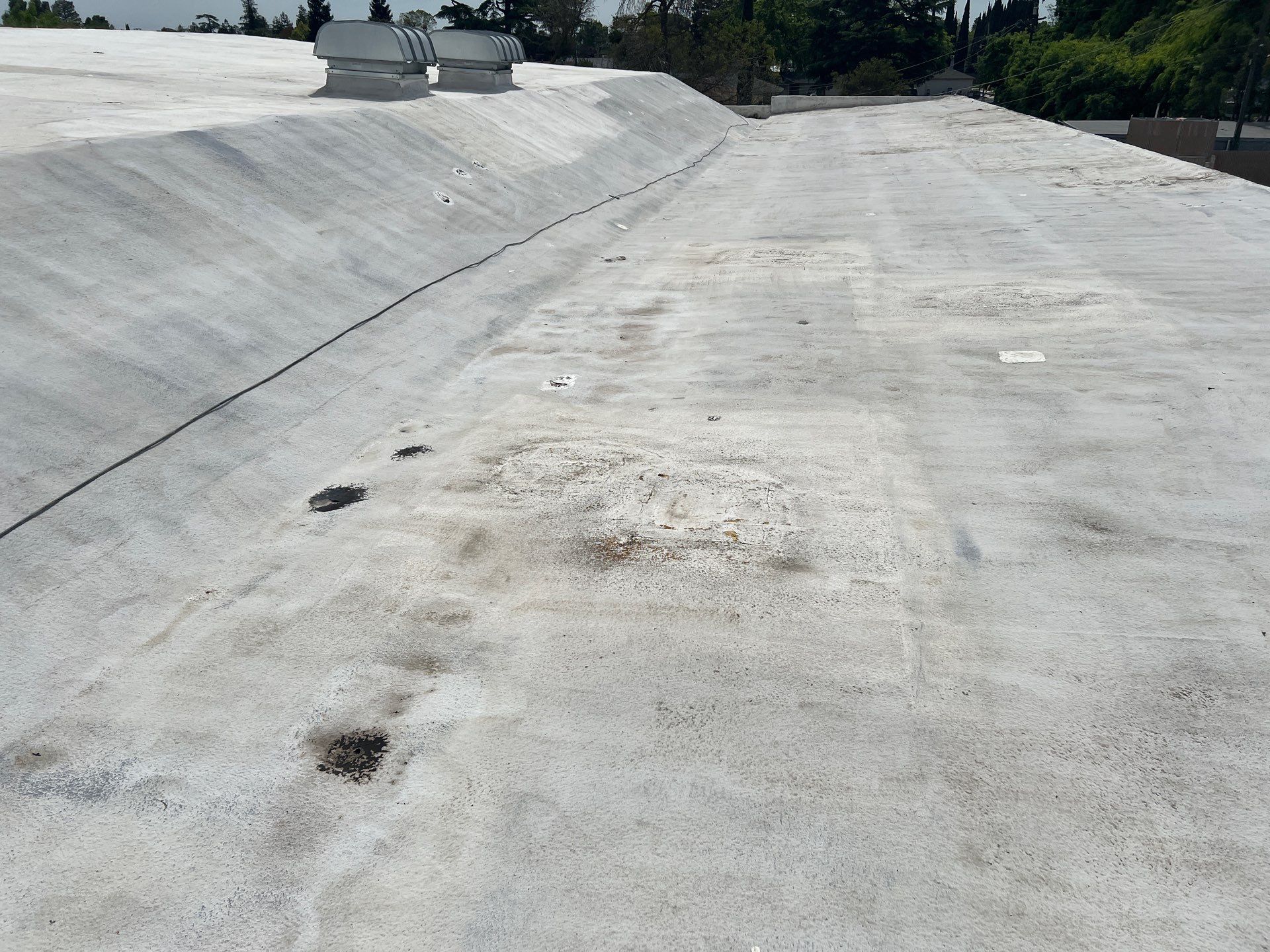 Foam Refurbish using Conklin Benchmark/PUMA XL coatings and spray foam by Straight Edge Roofing Inc