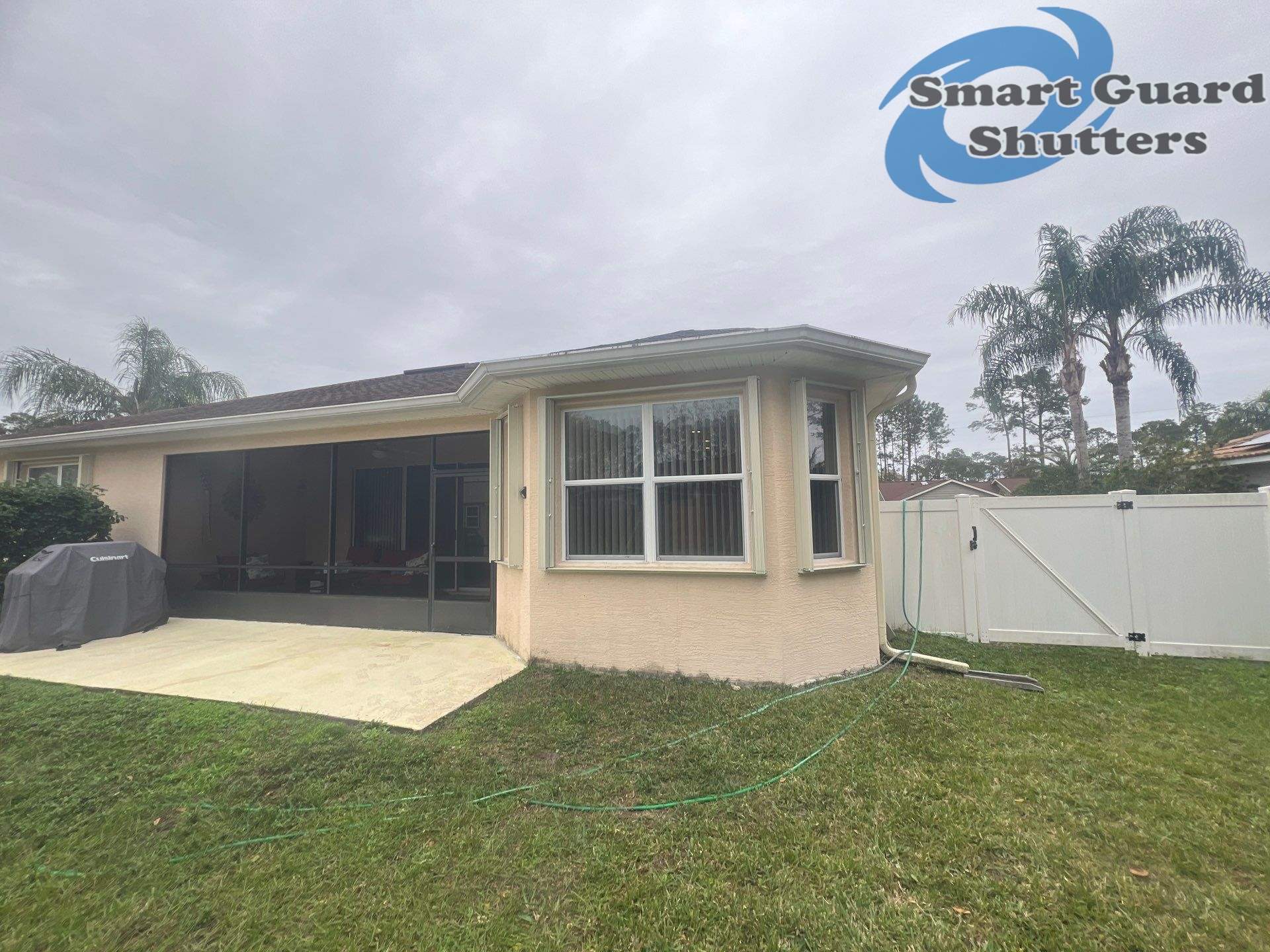 Accordion Shutters in Ivory by Smart Guard Shutters