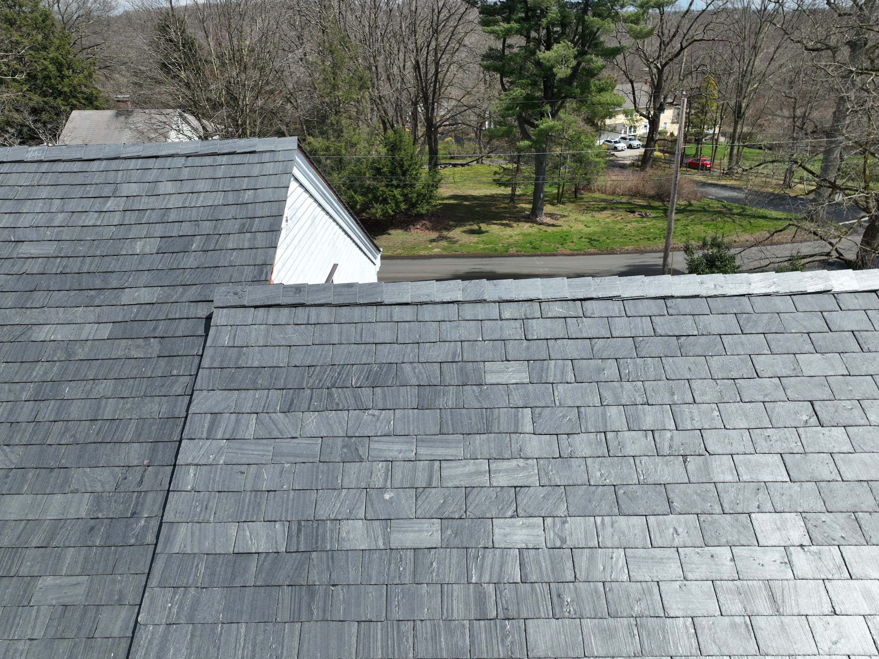 Residential Roofing Installation using Vermont Slate by A Plus Exterior