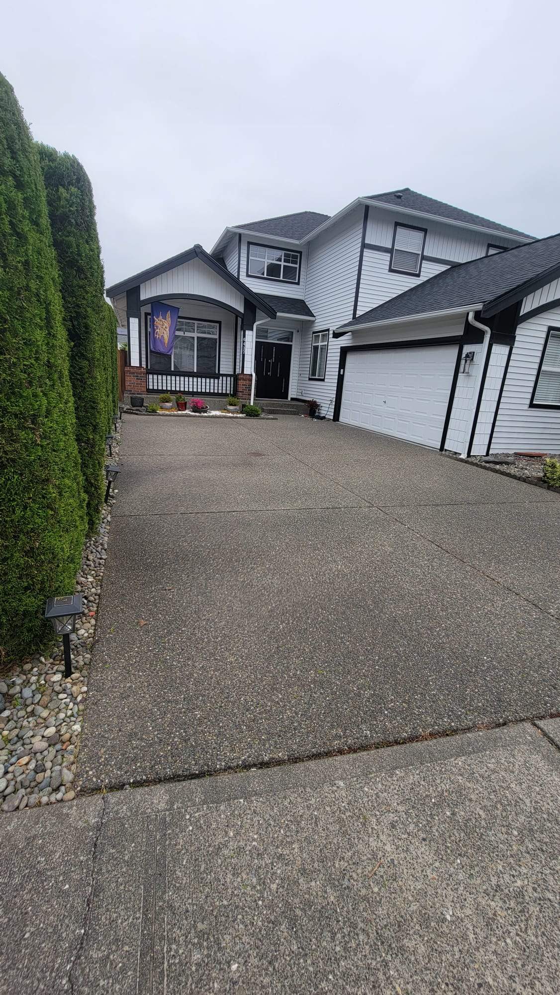 Poseidon Patio and Driveway by Concrete Coating Experts Inc.