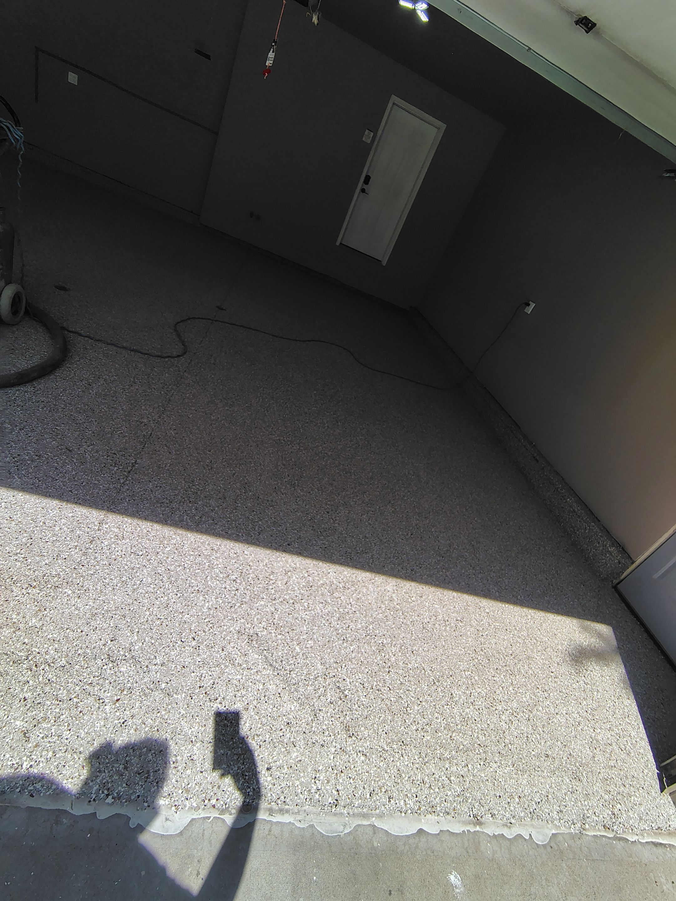 Sioux Falls Garage Concrete Repair and Epoxy Flake Floor Coating by Select Painting, Coatings & Garage Cabinets