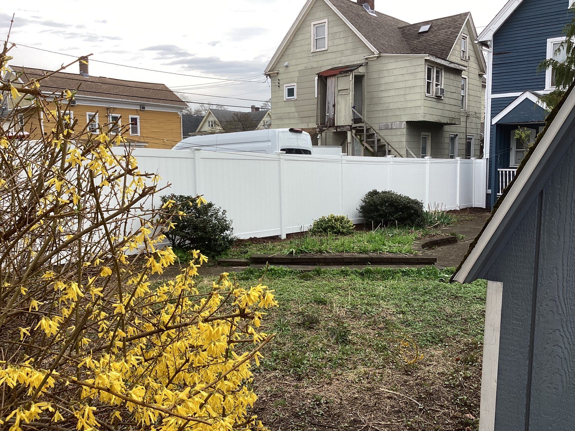 Fence replacement with white Vinyl privacy fence. by DiGiorgi Roofing and Siding Inc