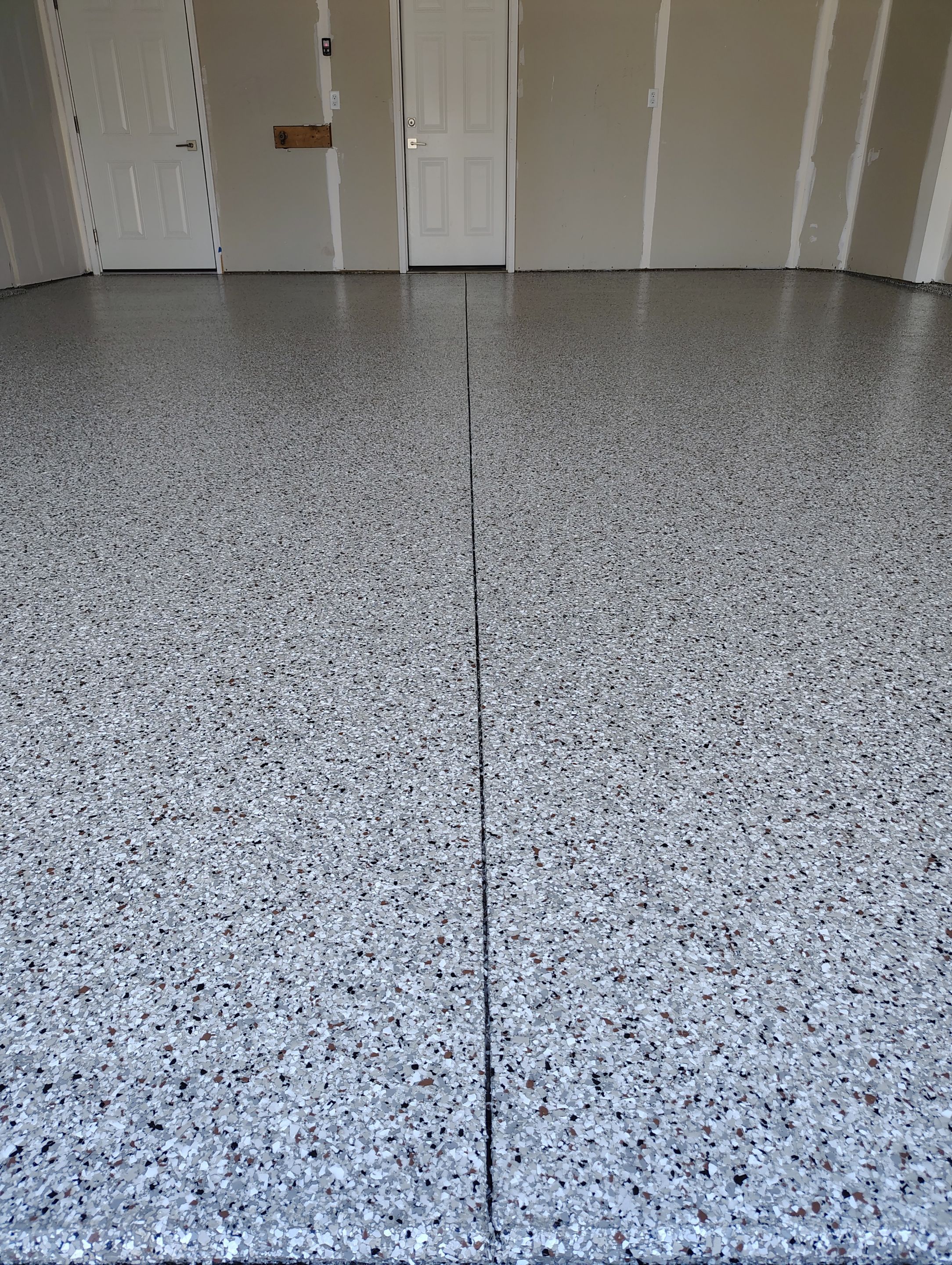 Custom Epoxy Garage Floor and Patio Coating in Sioux Falls by Select Painting, Coatings & Garage Cabinets