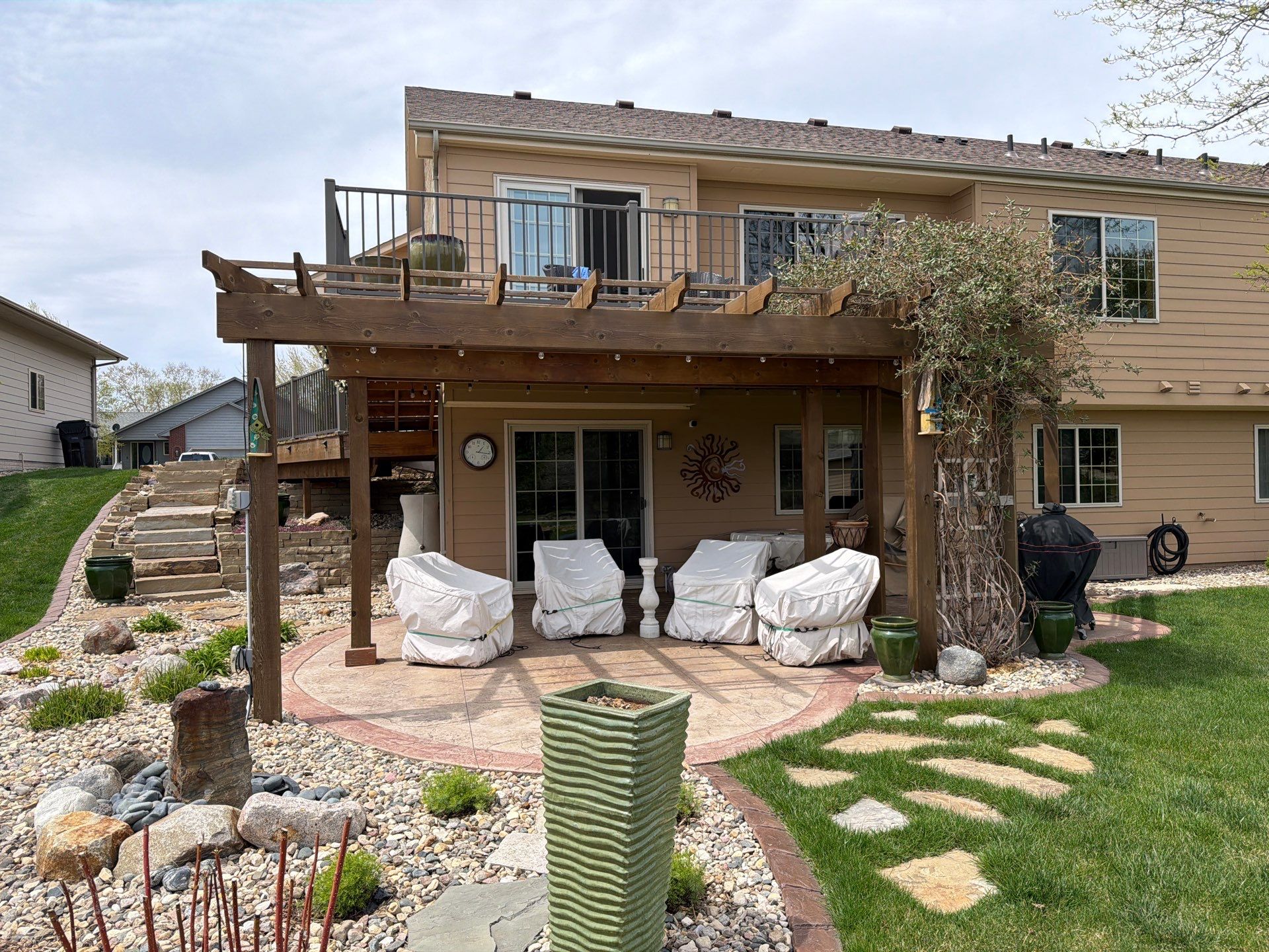 Custom Stamped Concrete Patio and Wood Pergola in Sioux Falls by Select Painting, Coatings & Garage Cabinets