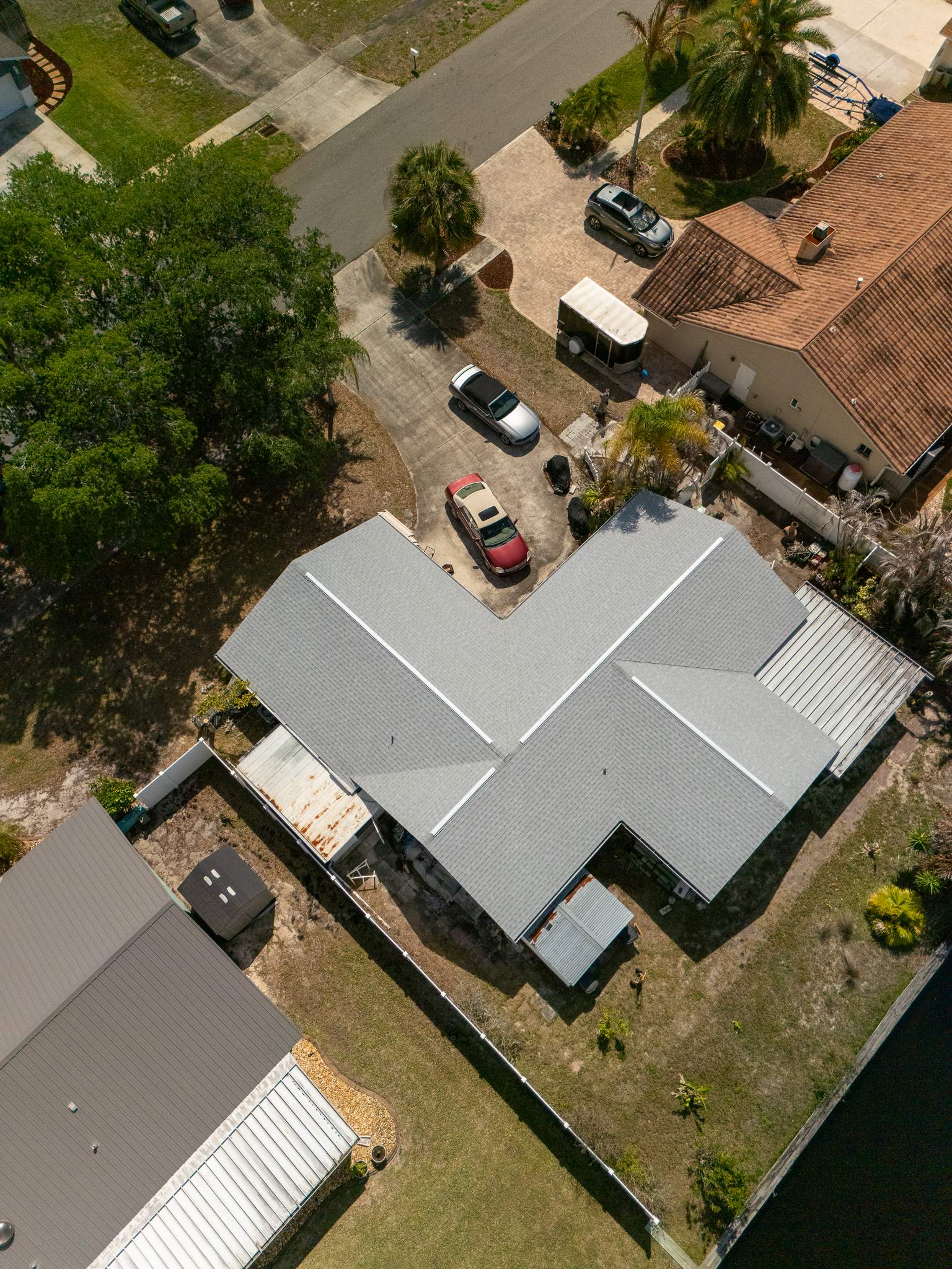 Merritt Island Roof Replacement Featuring Tamko Titan Glacier White Shingles by Wiedmann Construction & Roofing