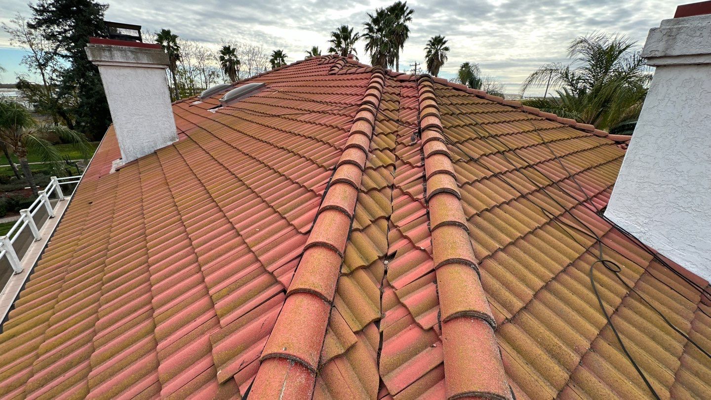 Tile refurbish project using existing tiles and replaced underlayment and battens by Straight Edge Roofing Inc