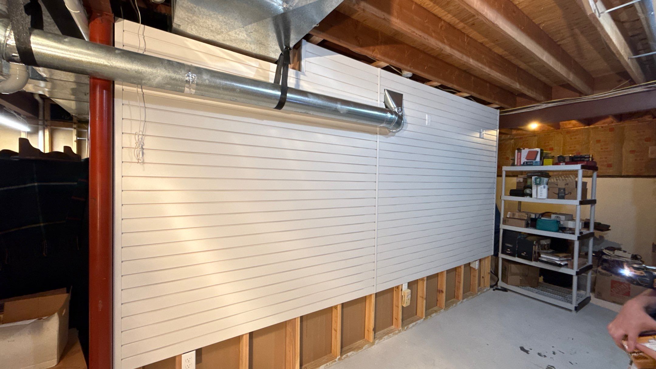 Garage Organization With Overhead Racks and Slatwall in Overland Park by Banner Garage