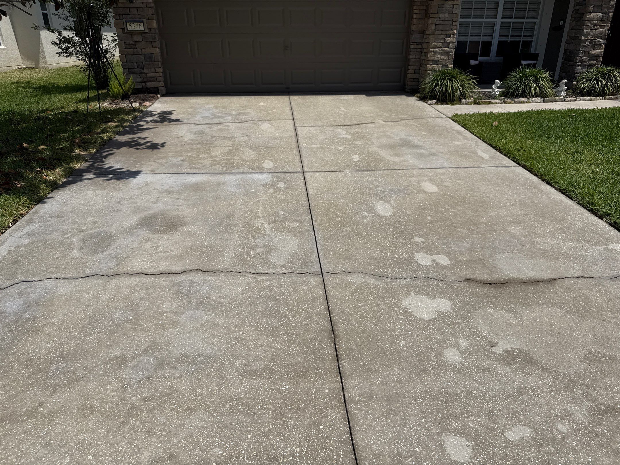 Concrete Driveway Oil Stain Removal | Harrison Ranch Community | Parrish, FL by Sunshine AquaWash