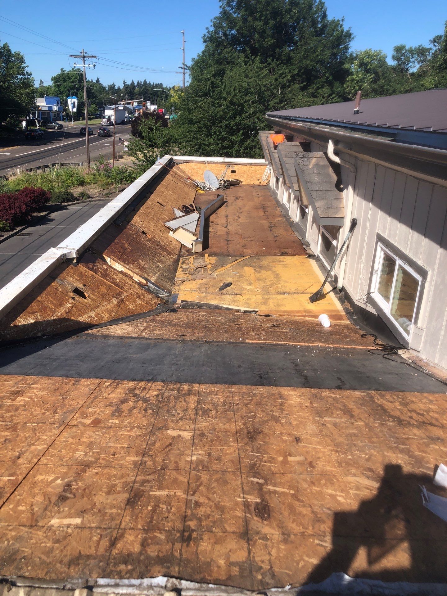Commercial Flat Roof Installation using Bruce and Dana Snap Lock Metal (Color: Brown) by Orezona Building & Roofing Company, Inc.
