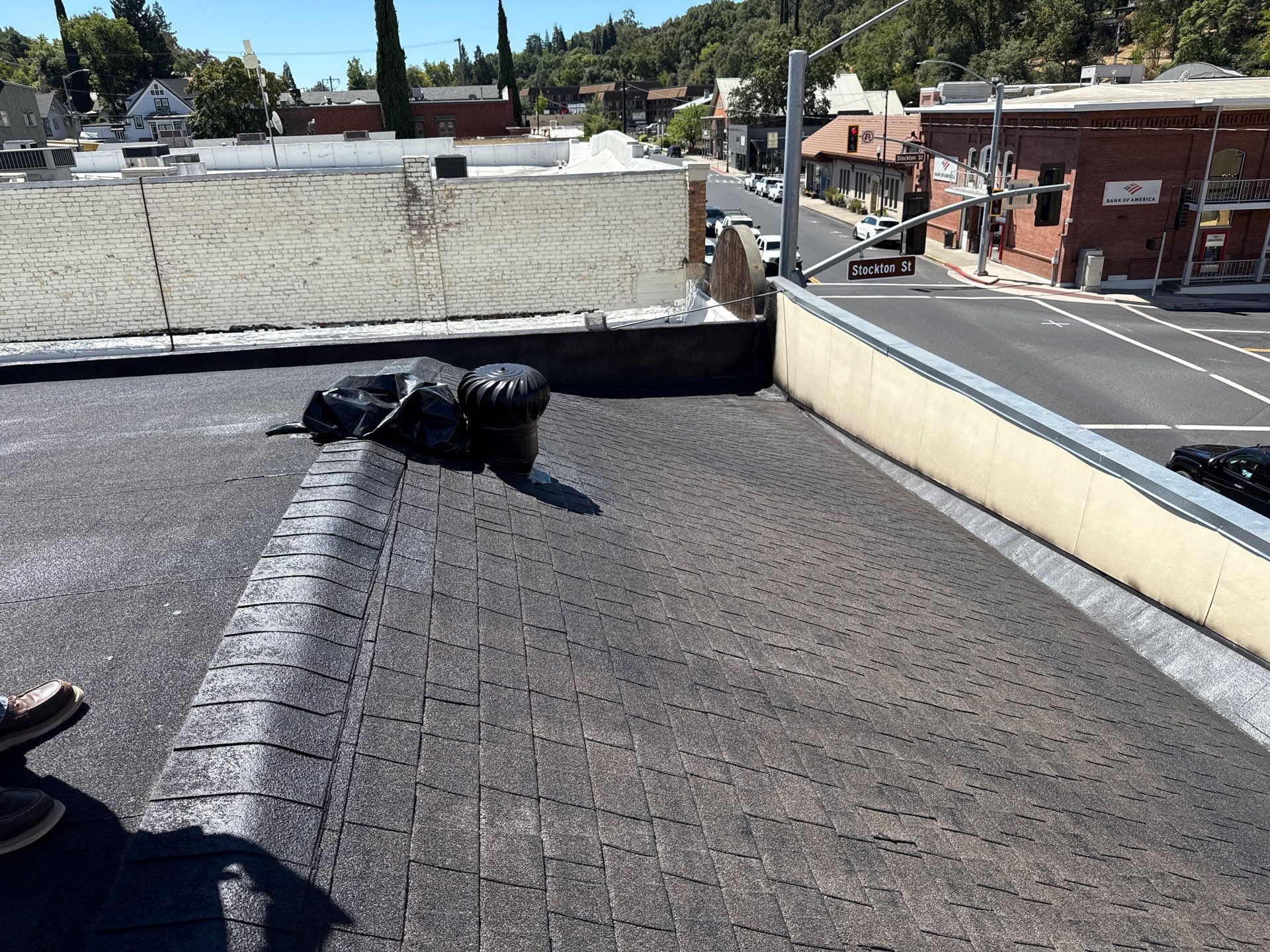 Foam and coatings on commercial roof by Straight Edge Roofing Inc