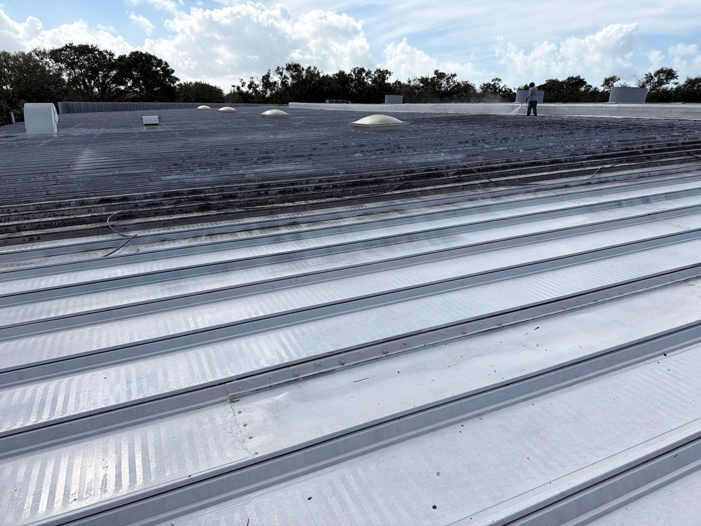 Sarasota Industrial Warehouse Metal Roof Silicone Coating Restoration by CES Roofing