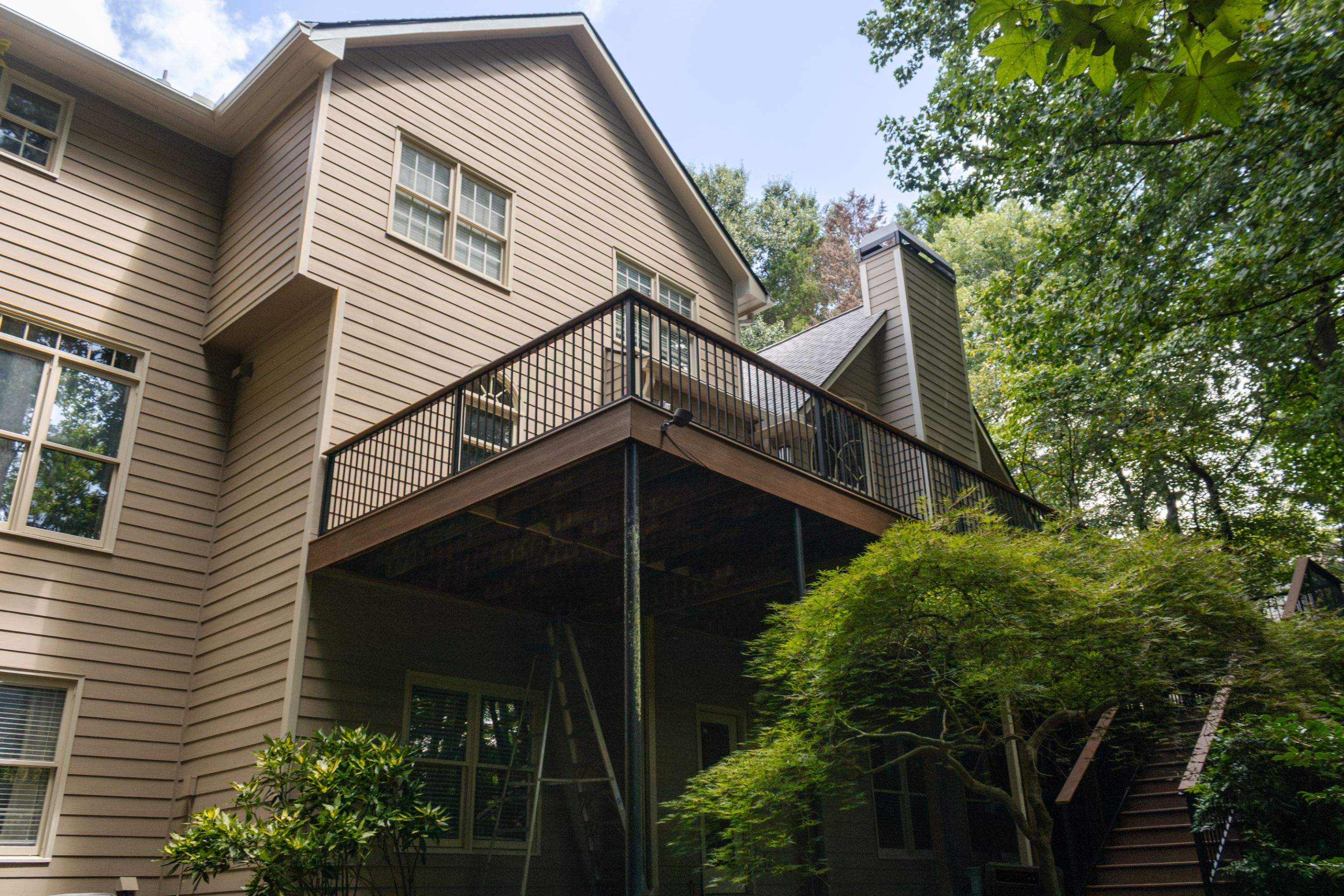 Full James Hardie Siding Replacement and Trex Deck Resurface in the Saddle Color by Nelson Exteriors 