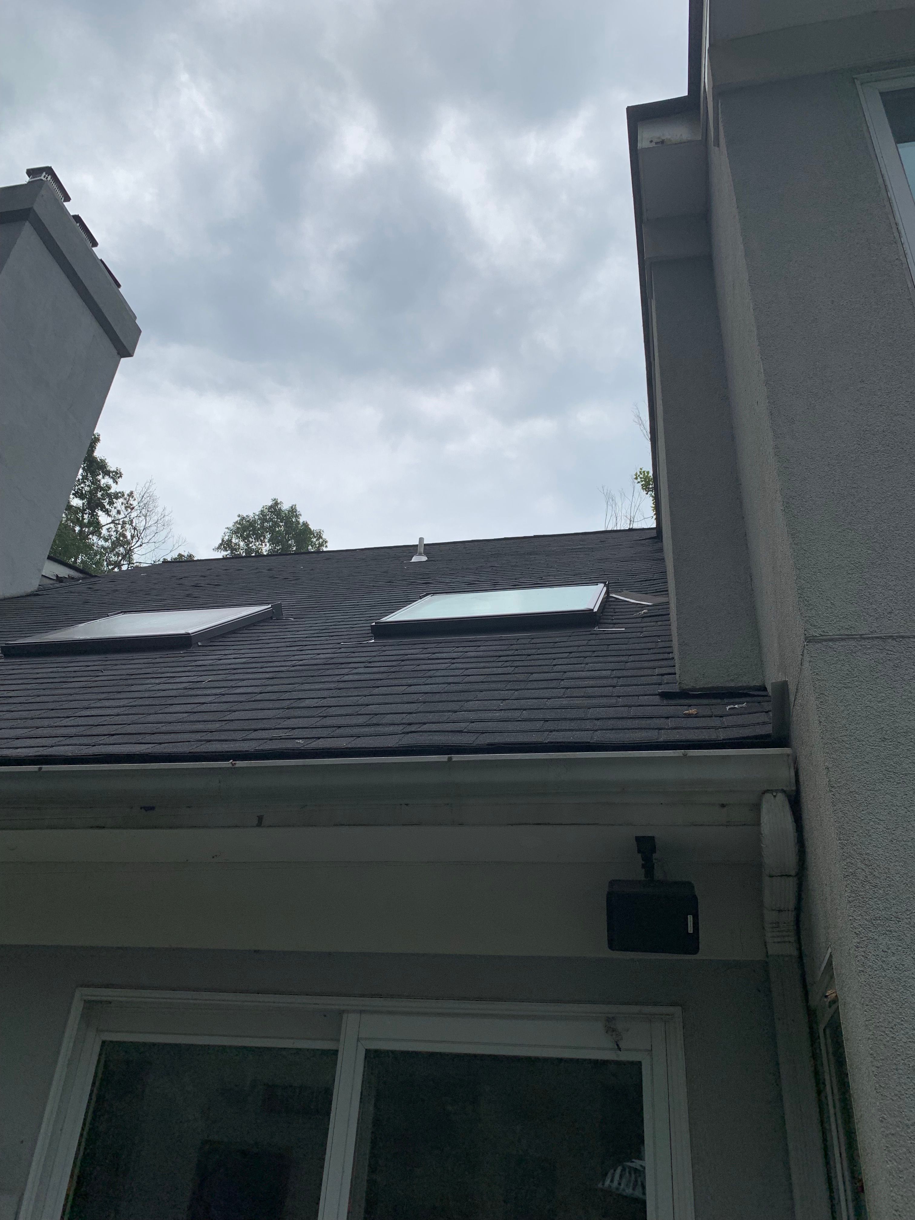 Skylight, Roof, and Gutter Replacement by American Home Contractors