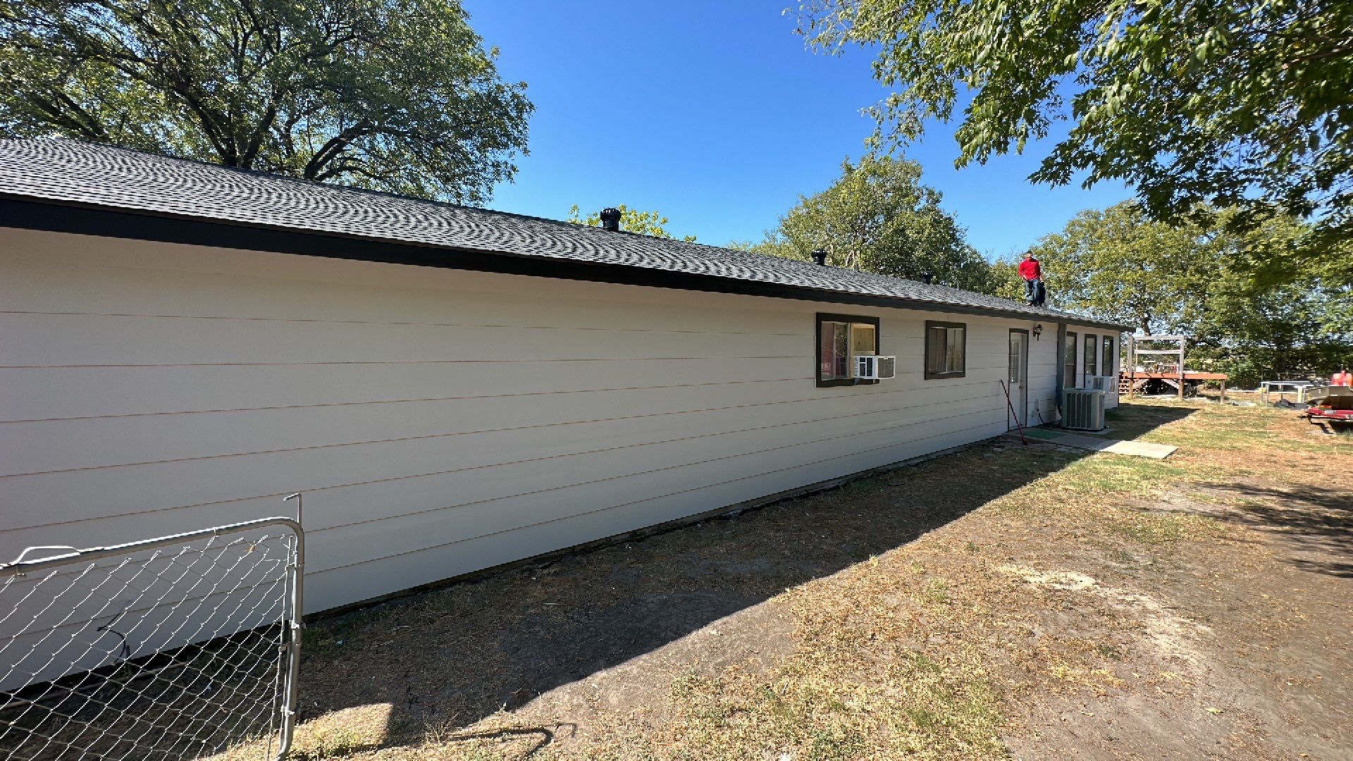 Atlas-Pristine Black with White Siding by Tejas Roofworks + Restoration