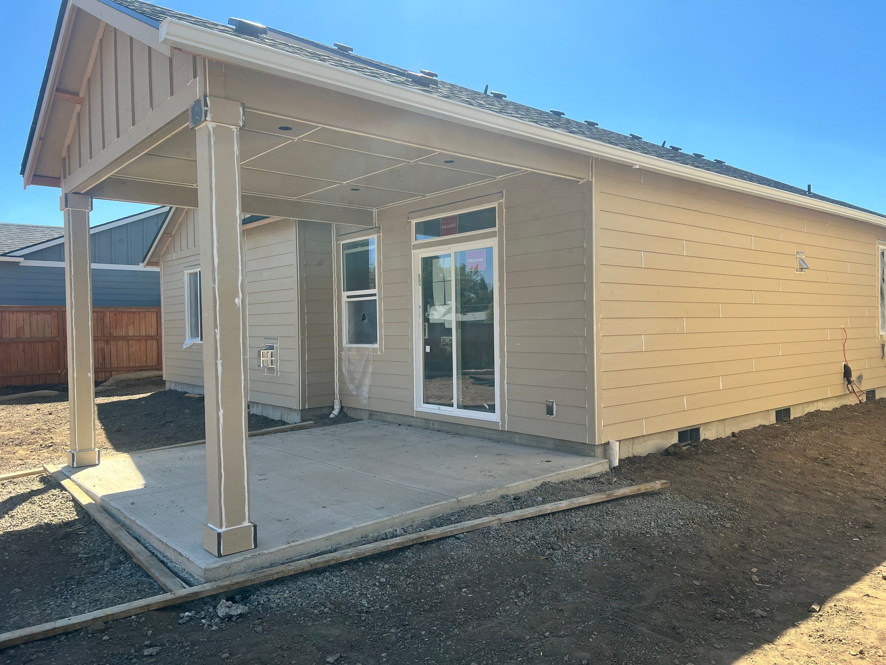 Continuous White Gutter and Downspout Installation for New Eugene Home by BEST Roofing & Waterproofing
