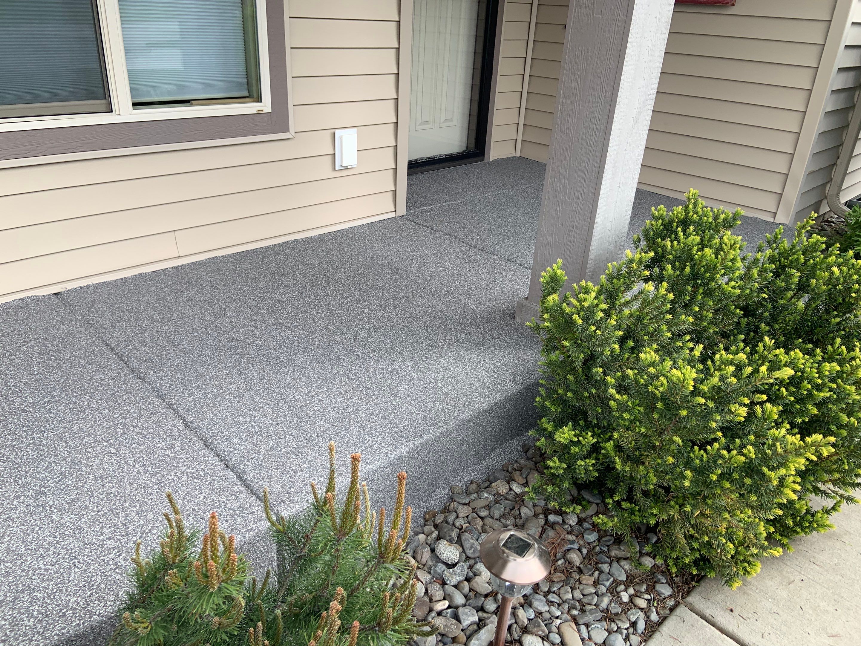 Garage Transformation using Pebble Beach and Front Porch using Greystone by Croc Coatings, LLC