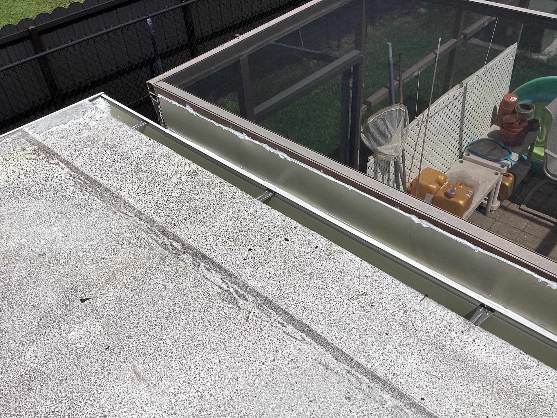 White Seamless Gutters and Splash Guards in Fort Myers FL by Gutter Professor by Gutter Professors