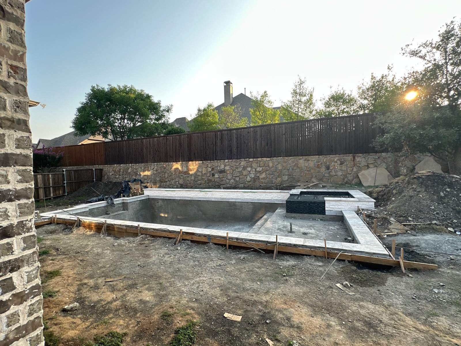 Geometric Pool with Raised Spa and Stone Decking by Pinnacle Pools and Spas - DFW