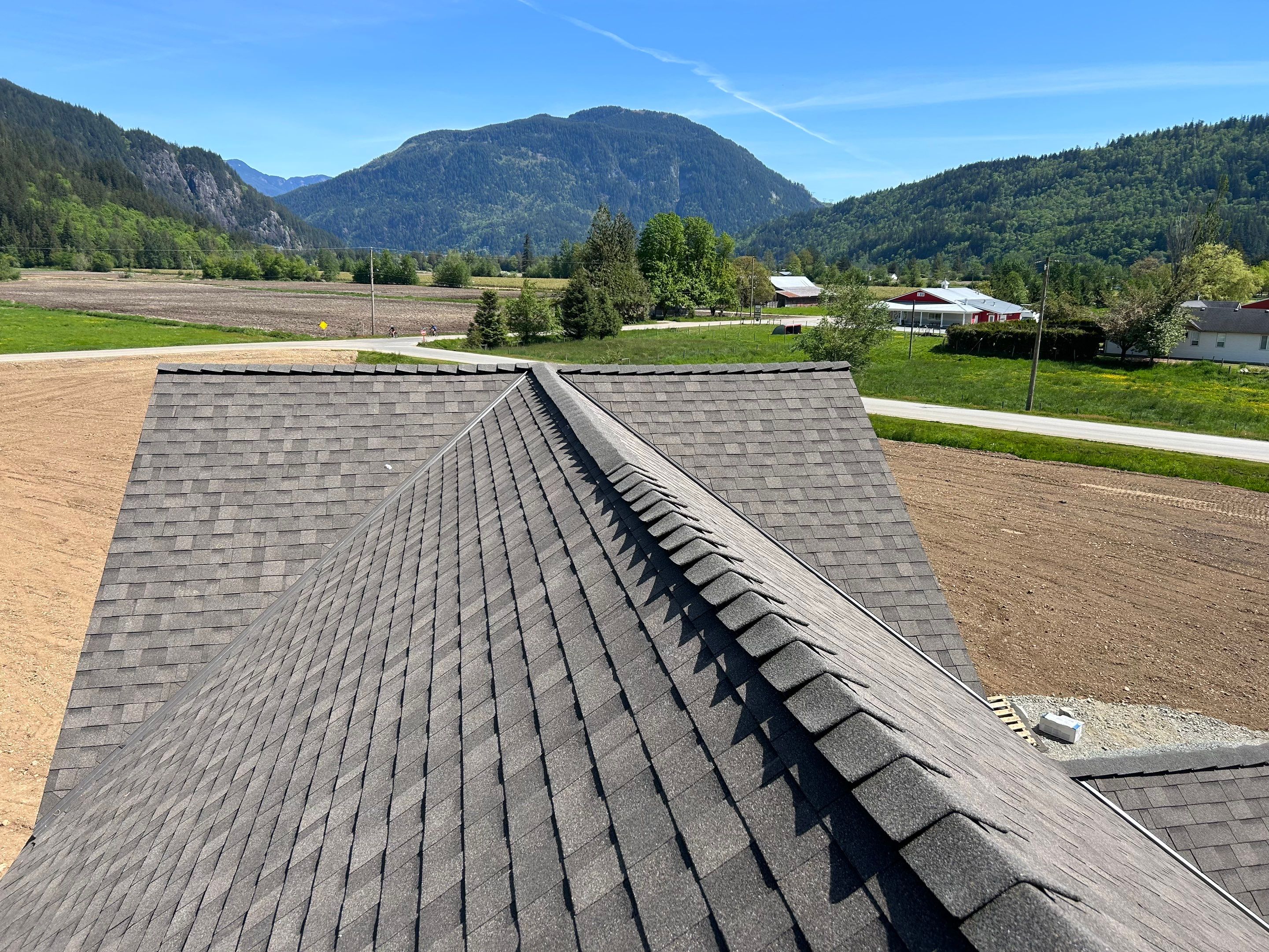Residential Roofing Installation upgraded venting and hip and ridge capping by Top Notch Roofing Inc