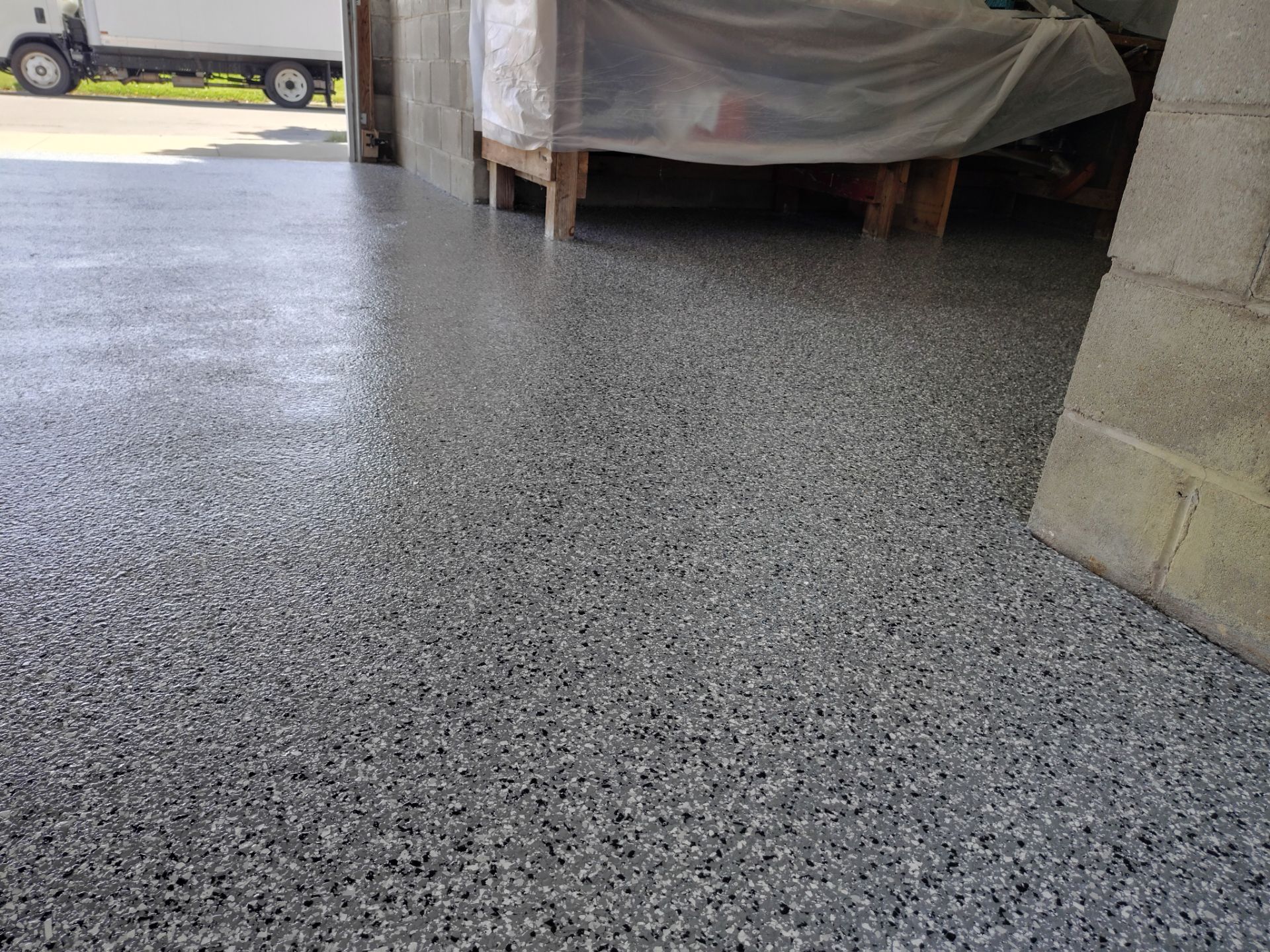 Wombat Flake Garage Floor Coating in Perry, IA by Revival Concrete Coatings