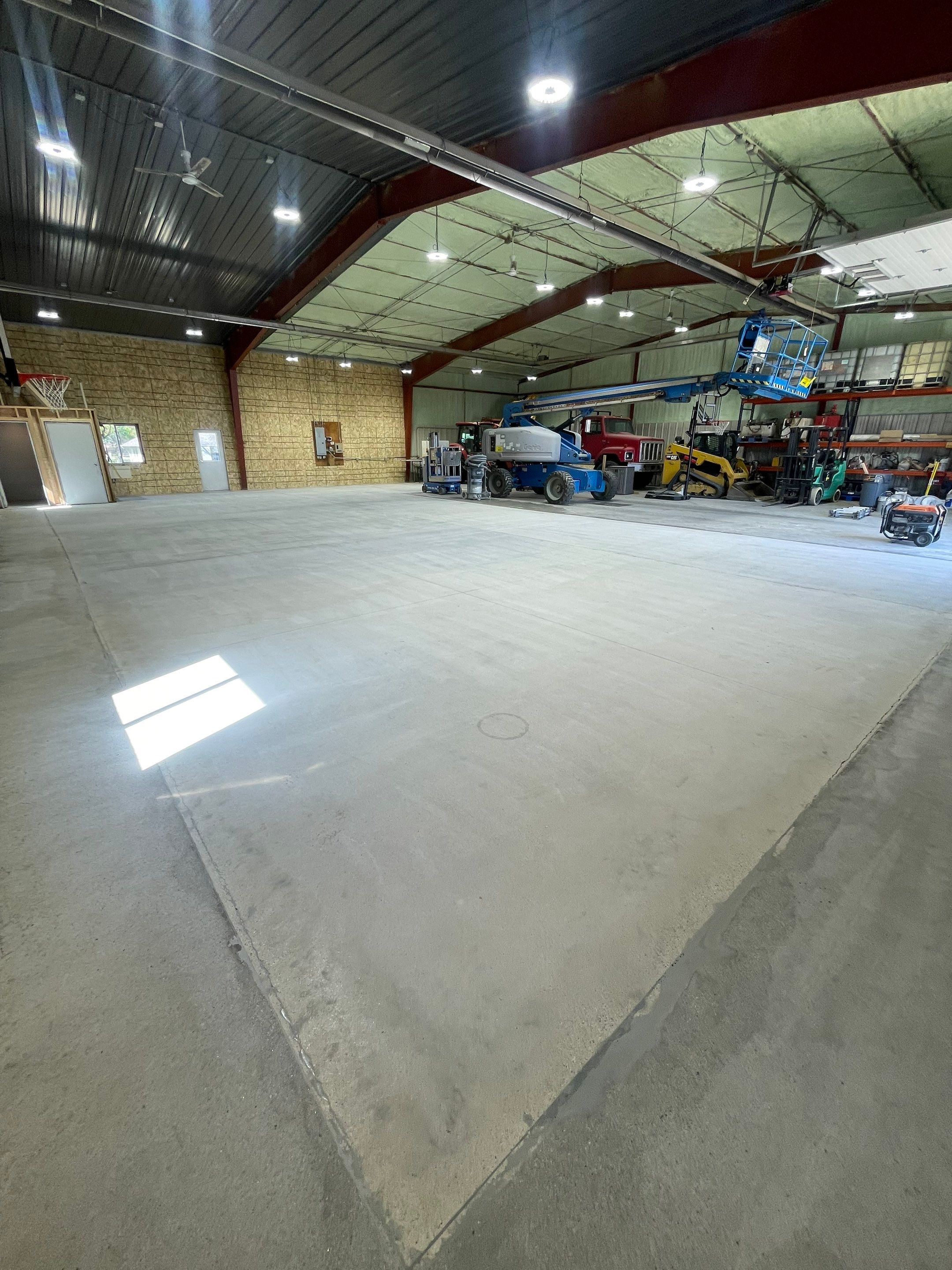 Custom Polyurea Shop Floor with Basketball Court Lines in Rock Valley by Select Painting, Coatings & Garage Cabinets