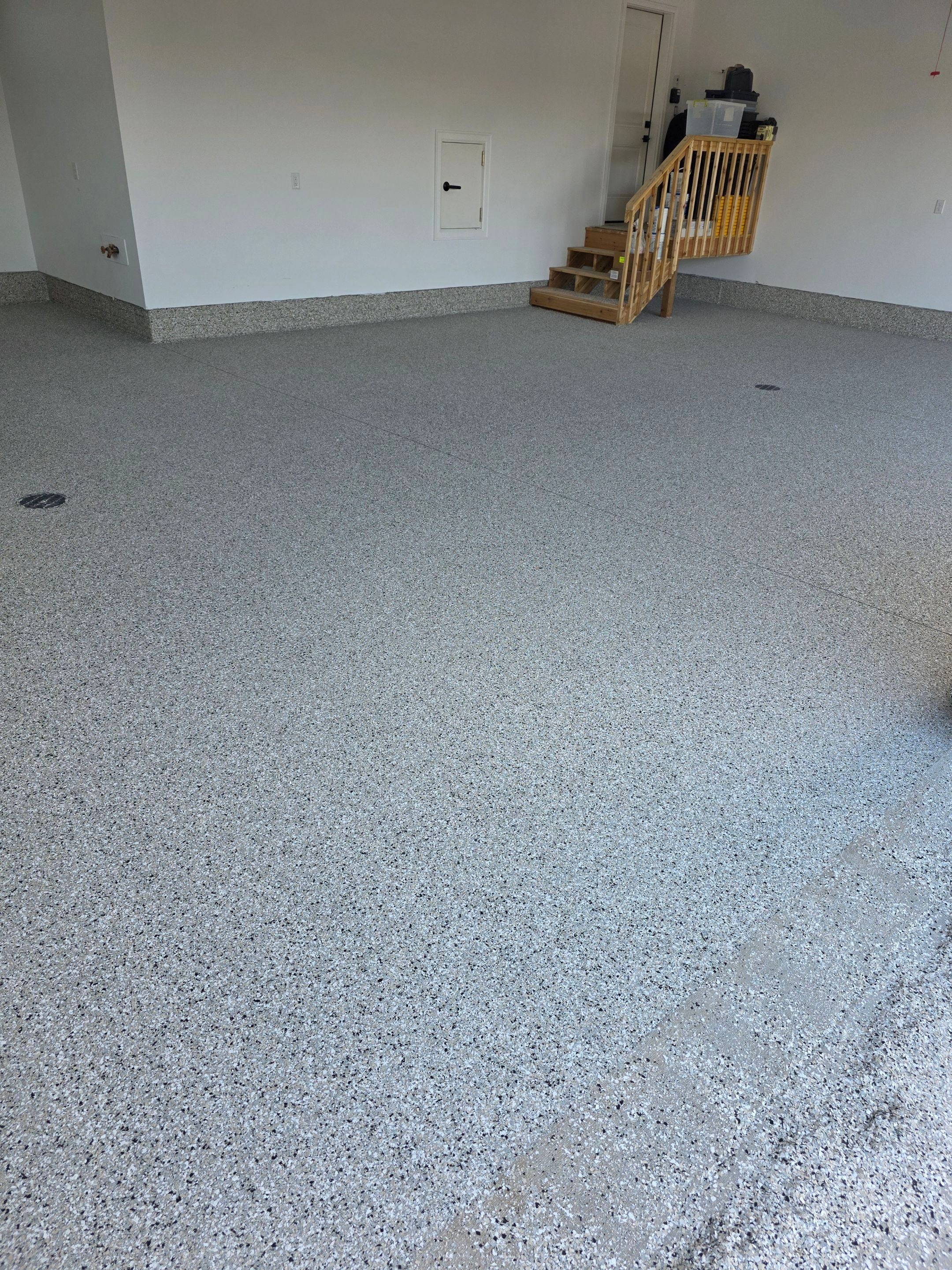 Gray and Black Speckled Polyurea Garage Floor in Dell Rapids by Select Painting, Coatings & Garage Cabinets