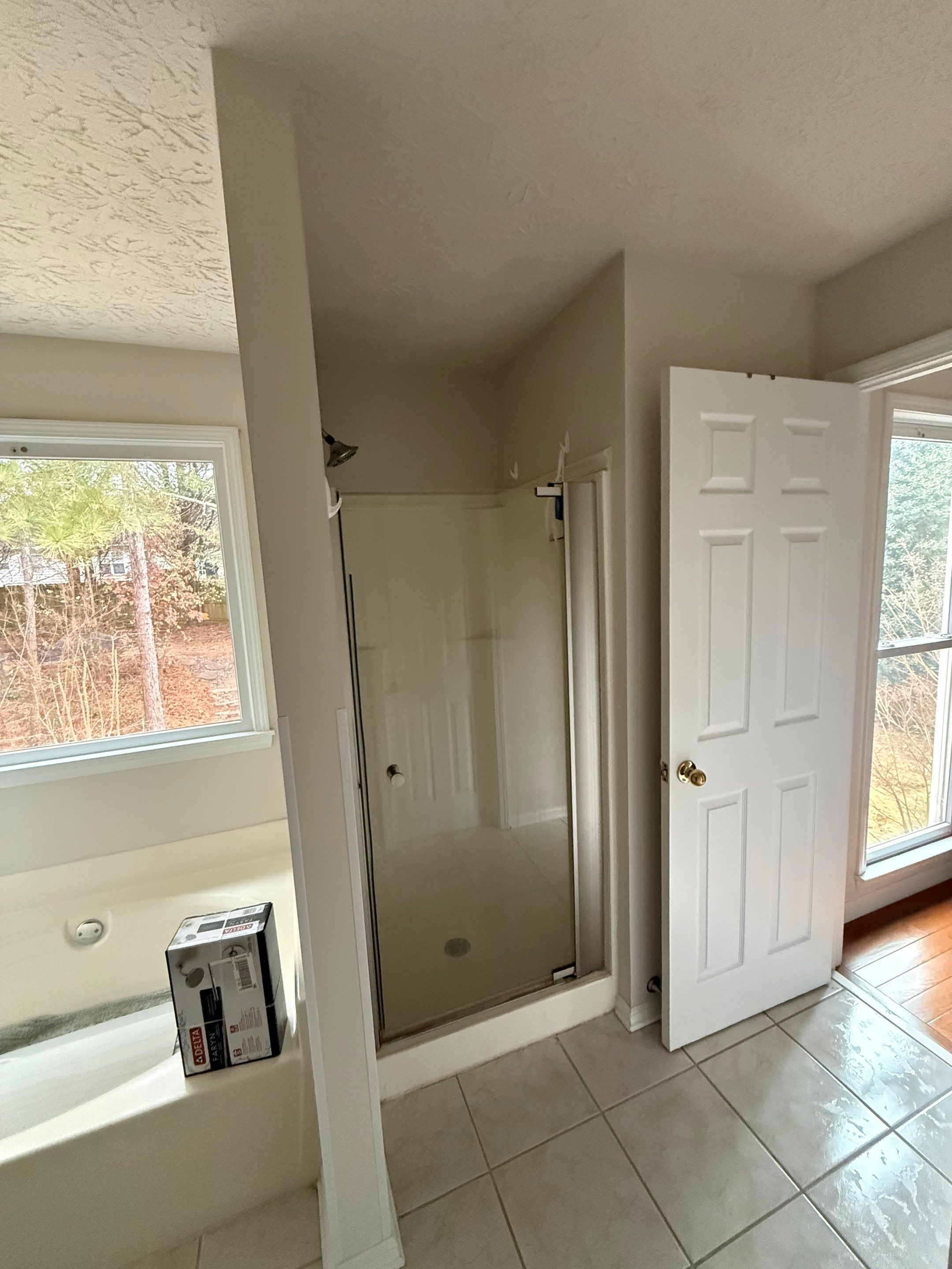 Custom Shower Renovation With Vertical Tile and Frameless Glass in Kennesaw by Swift Home Renovations