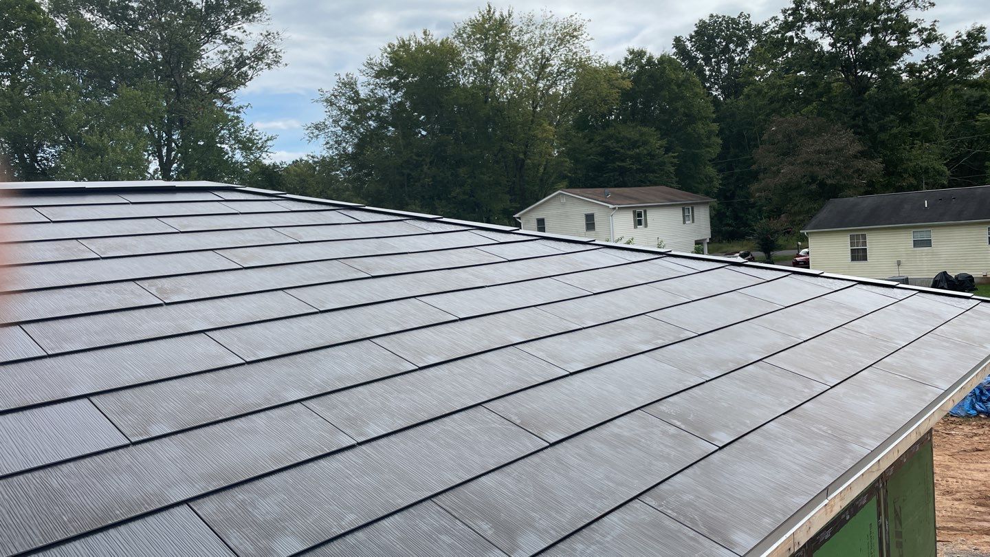 Tesla Solar Roof  using Tesla Solar Roof V3 tiles by American Home Contractors