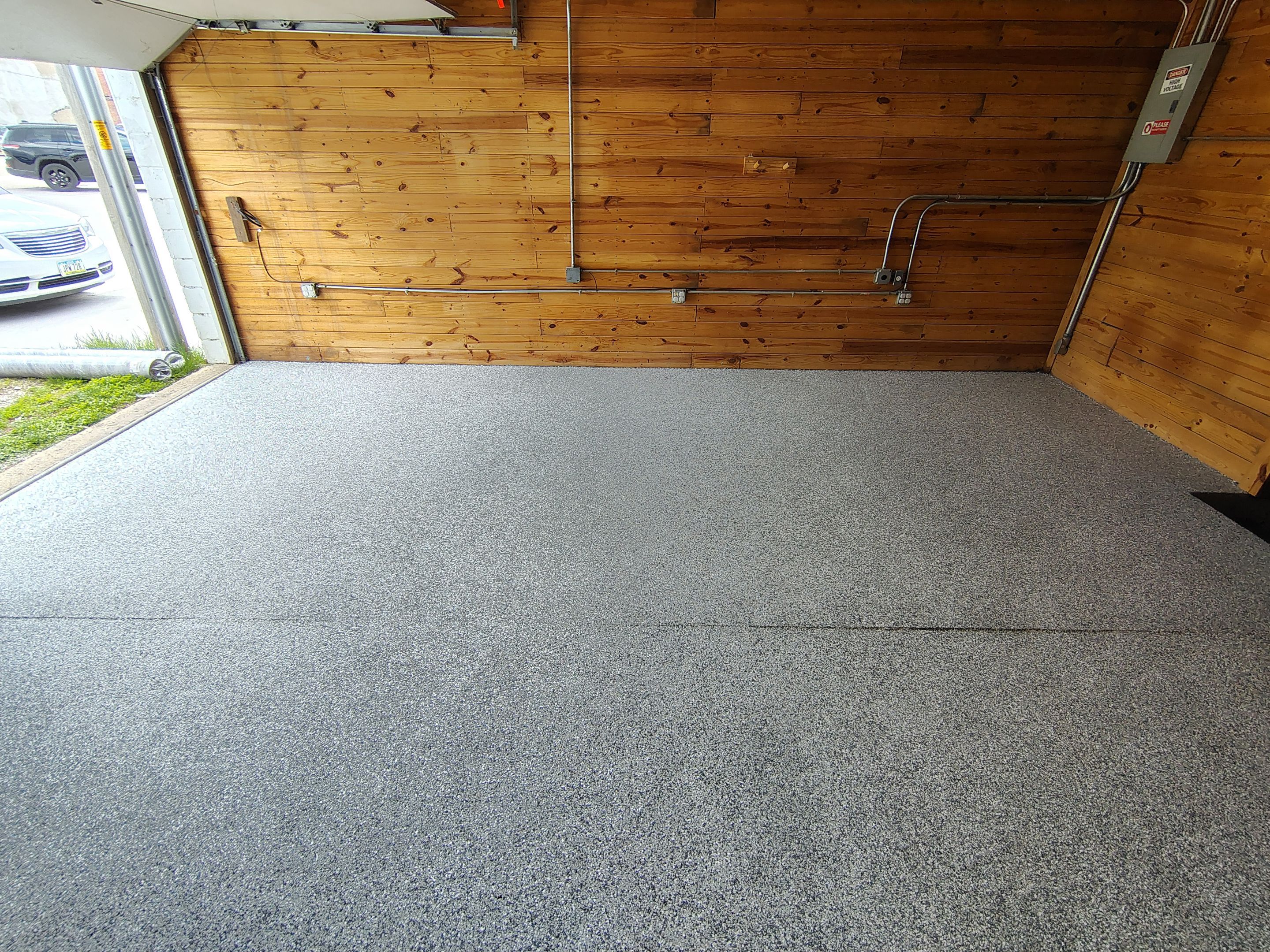 Commercial Epoxy Flake Floor Coating in Emmetsburg, Iowa by Select Painting, Coatings & Garage Cabinets