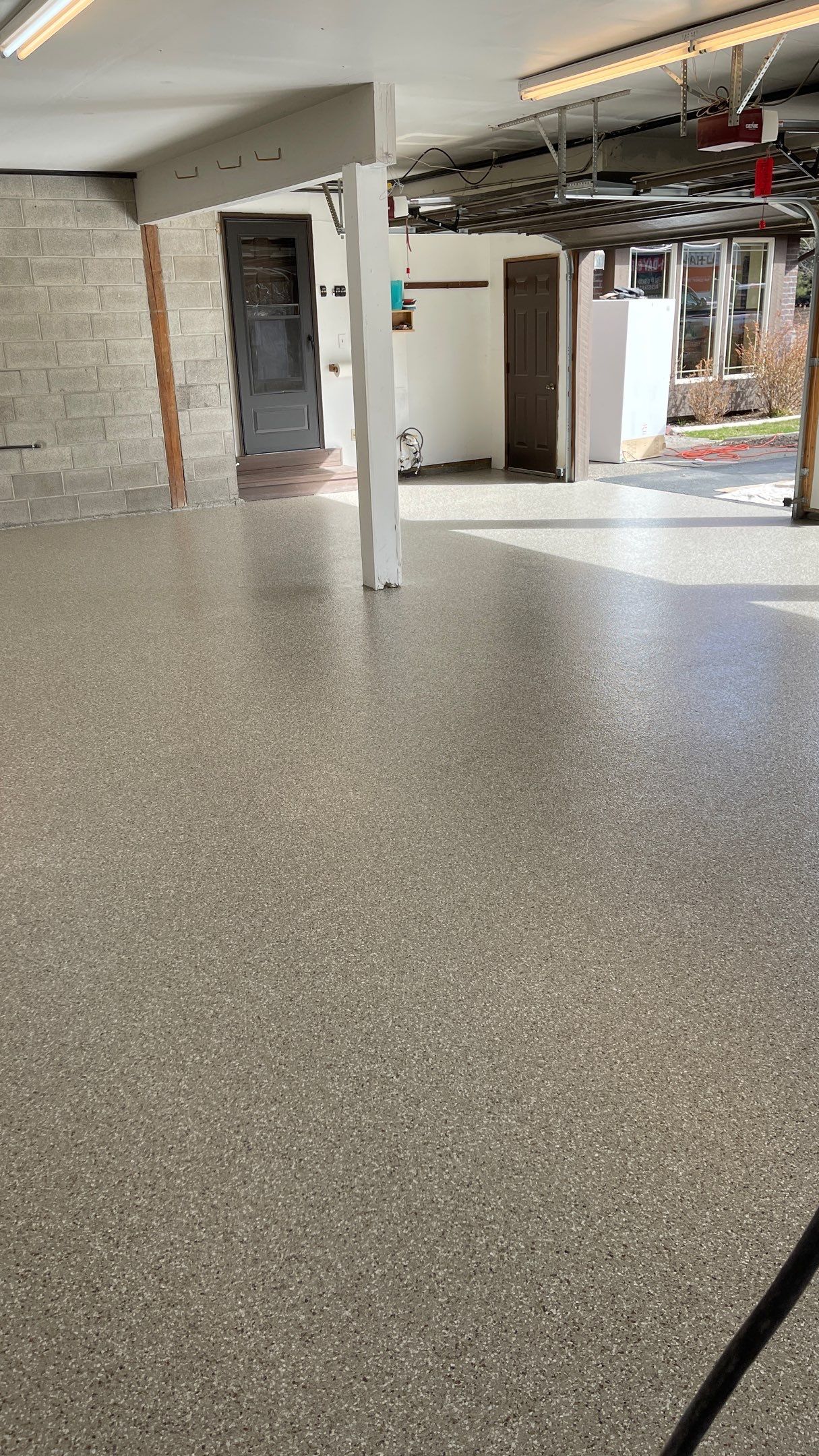 Garage Floor Polyaspartic Coating with Pebble Beach 1/4" Flakes by Croc Coatings, LLC