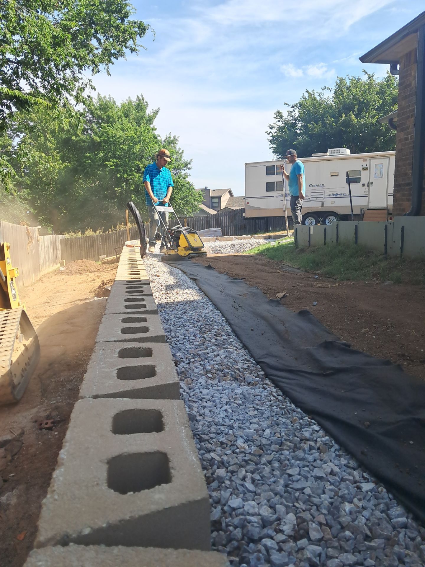 Custom Segmental Block Retaining Wall and Sod Installation in Lawton by Clays Services Inc