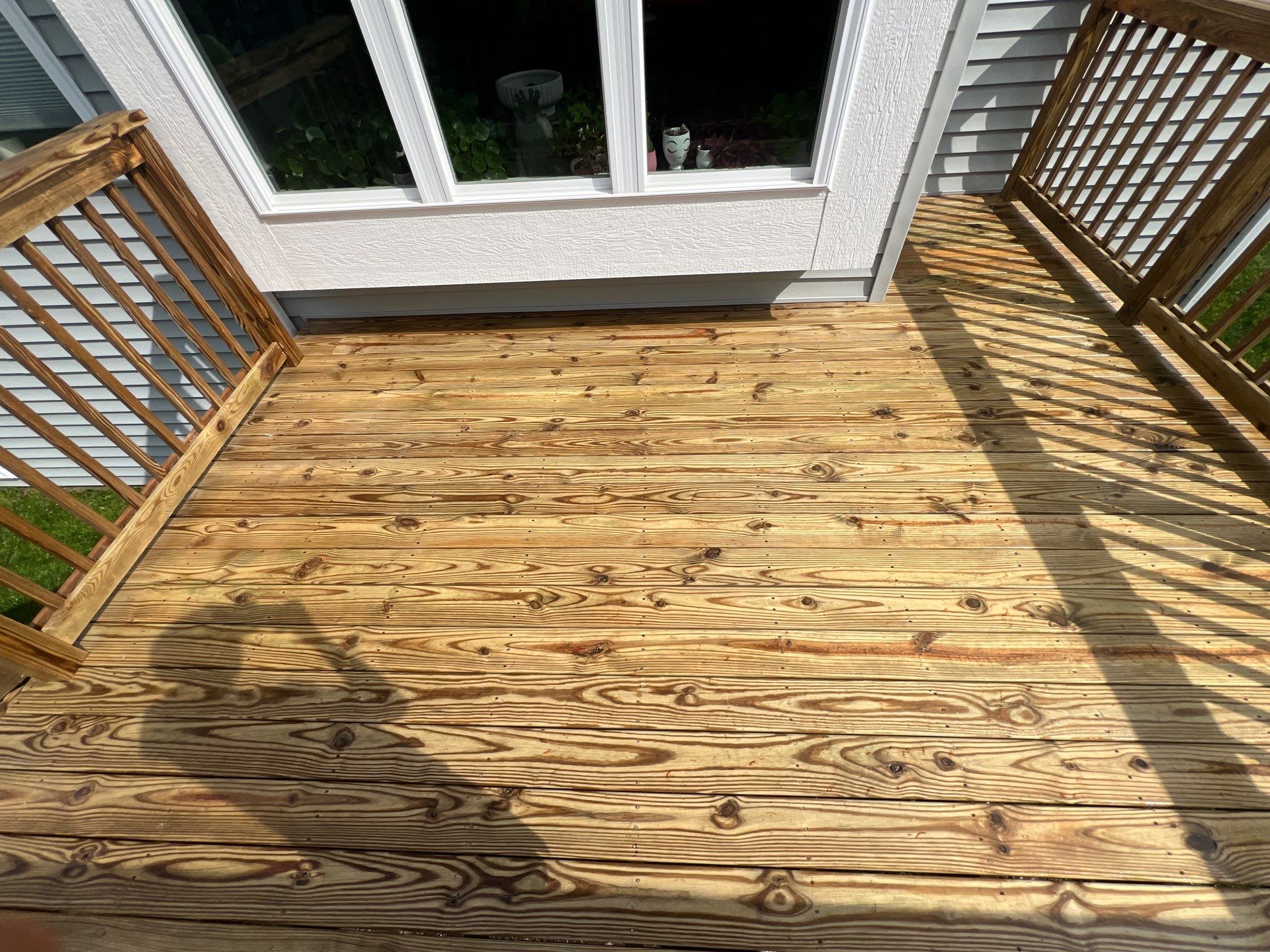 wood deck cleaning and staining by Northern Power Washing LLC.
