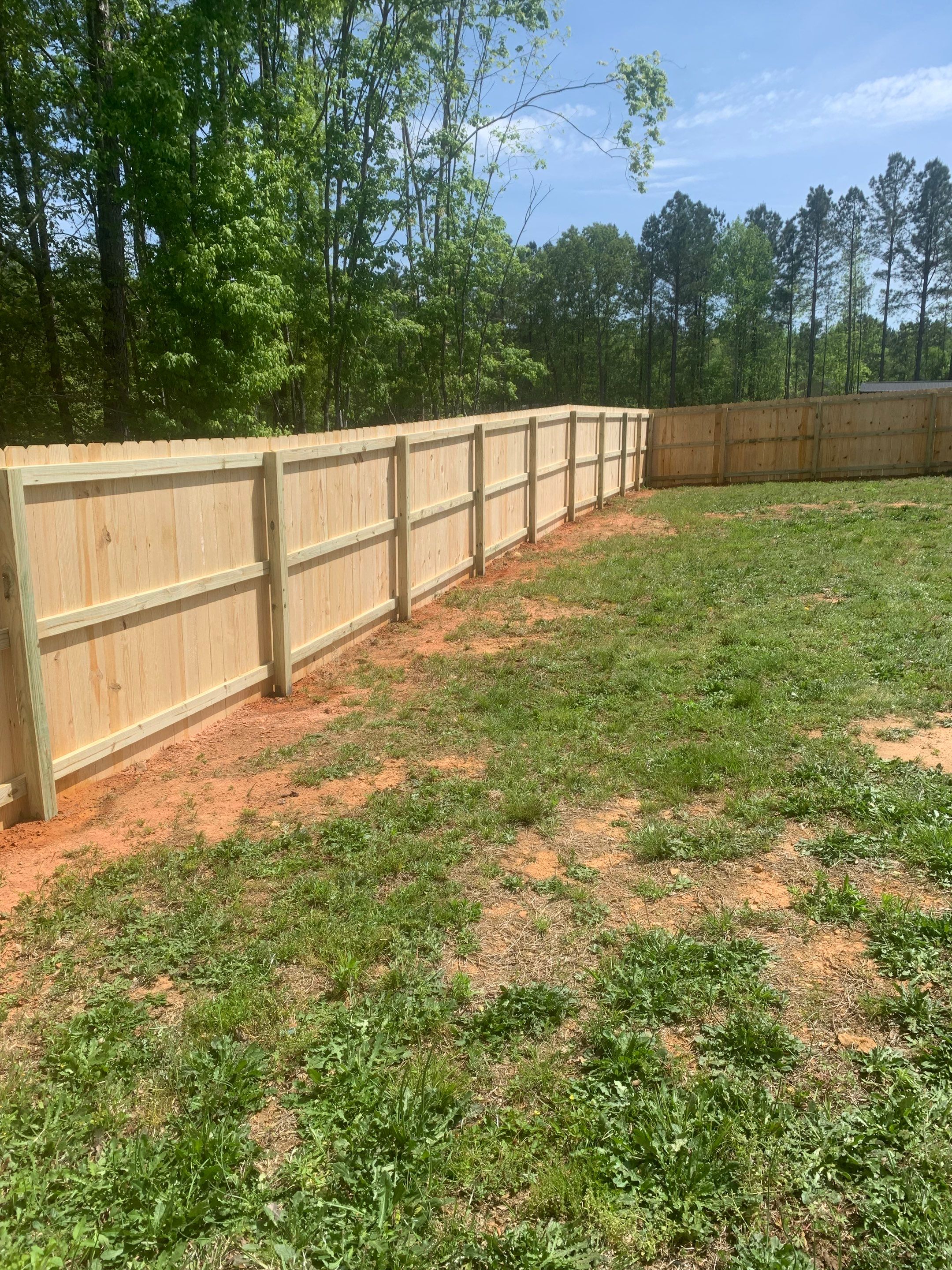 Stockade Wood Project in Roanoke Rapids by Superior Fence and Rail