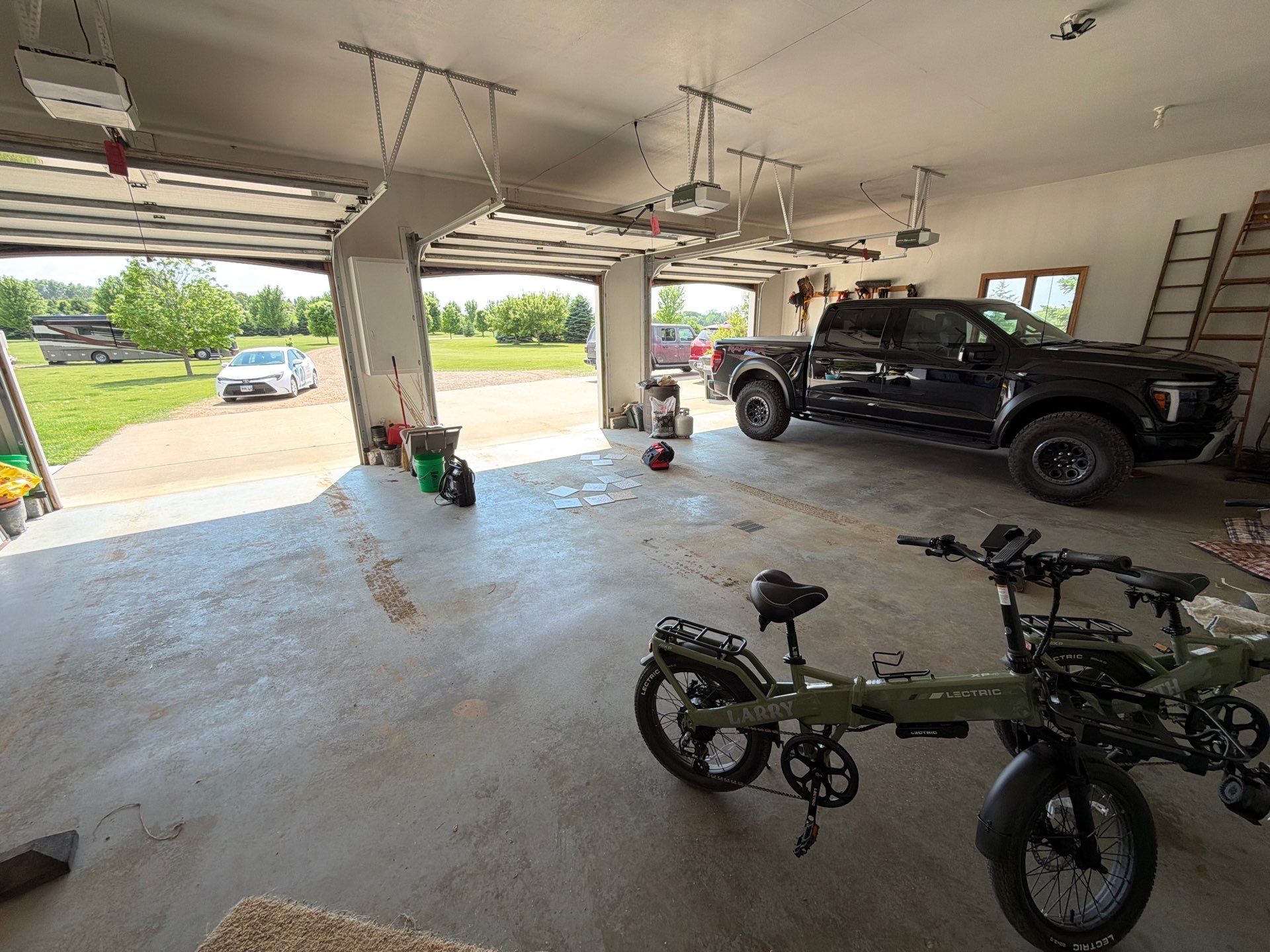 Feather Grey Garage Floor Coating Installation in Valley Springs by Select Painting, Coatings & Garage Cabinets