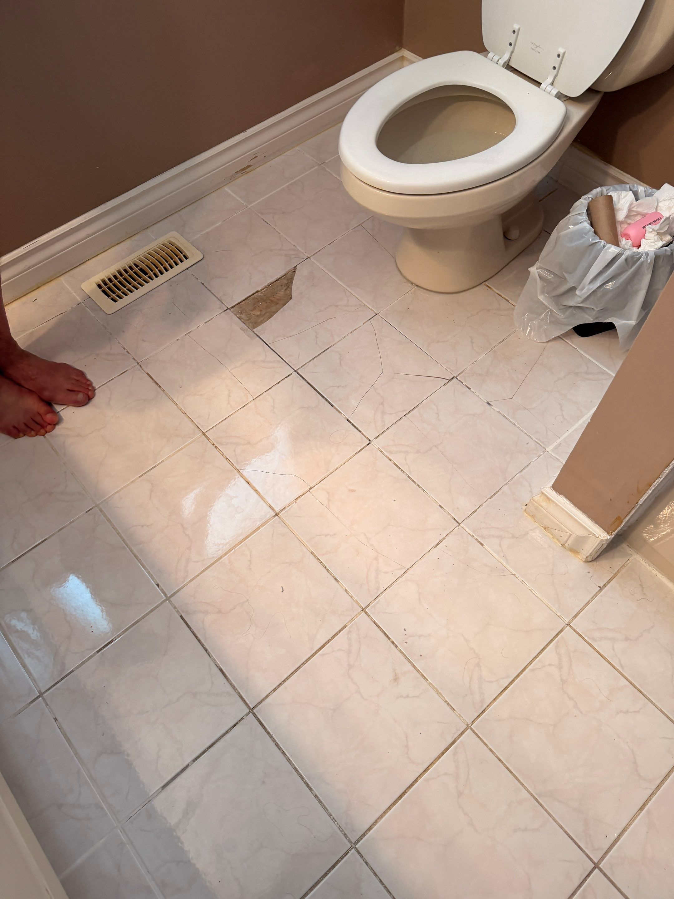 Bathroom Tile Floor Upgrade After Toilet Leak – West Vancouver Rental Property by YVR Construction Group