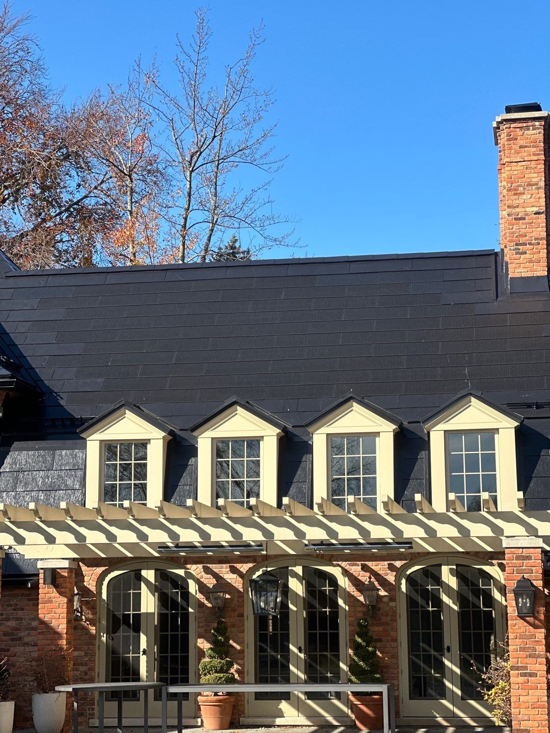 Tesla Solar Roof Replacement  by American Home Contractors