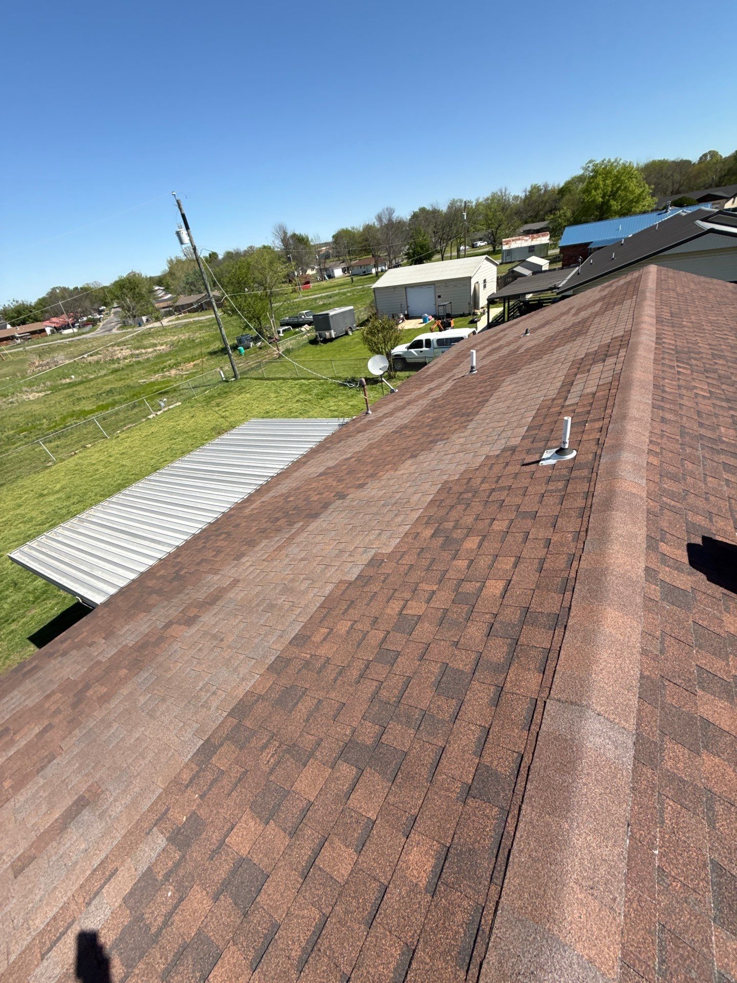 New roof & siding paid by insurance. Along with new roof sheathing.  by In & Out Construction & Remodeling, LLC