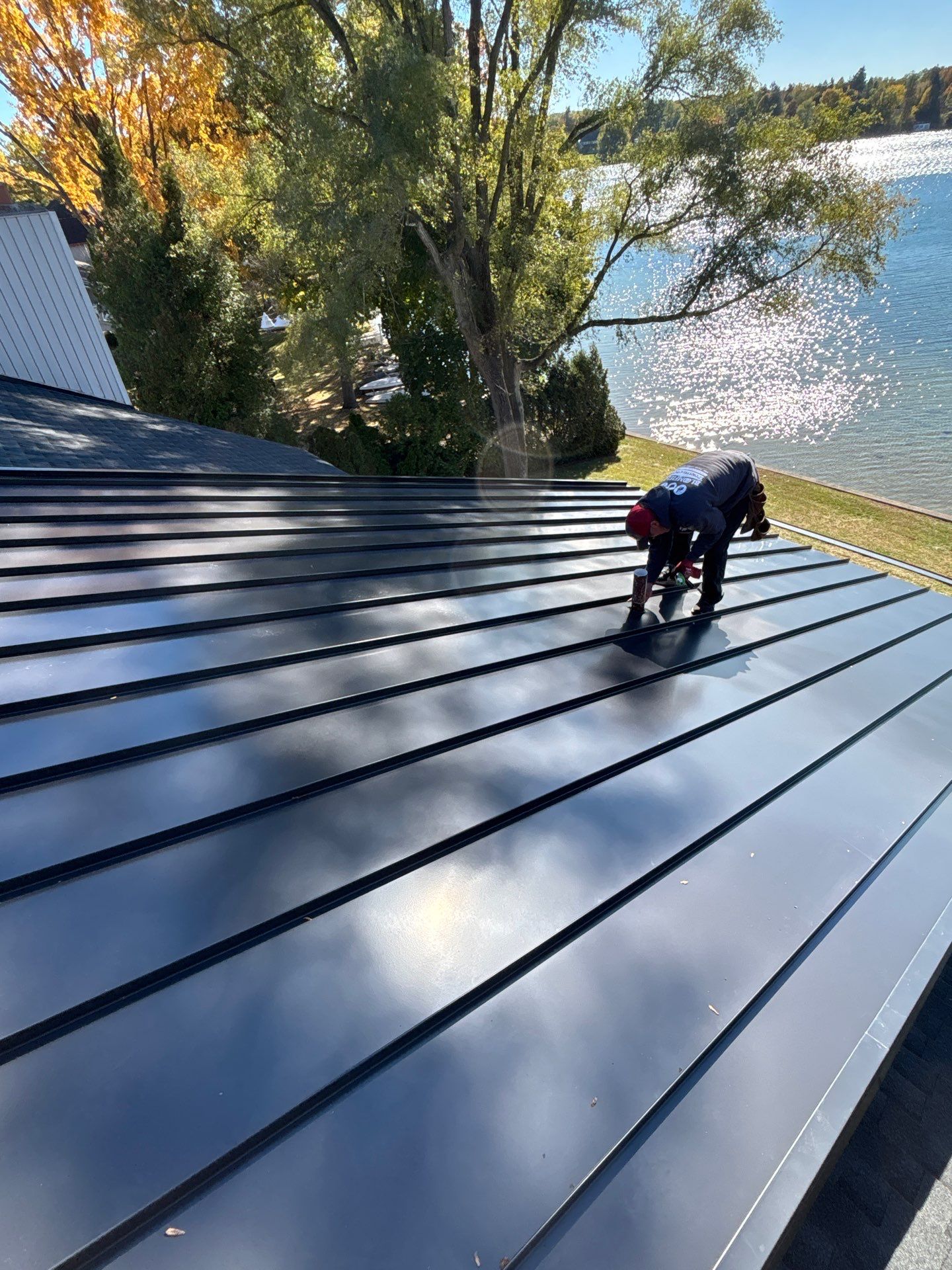 New Shingle Roof with Metal roof accents by Bloomfield Construction & Restoration