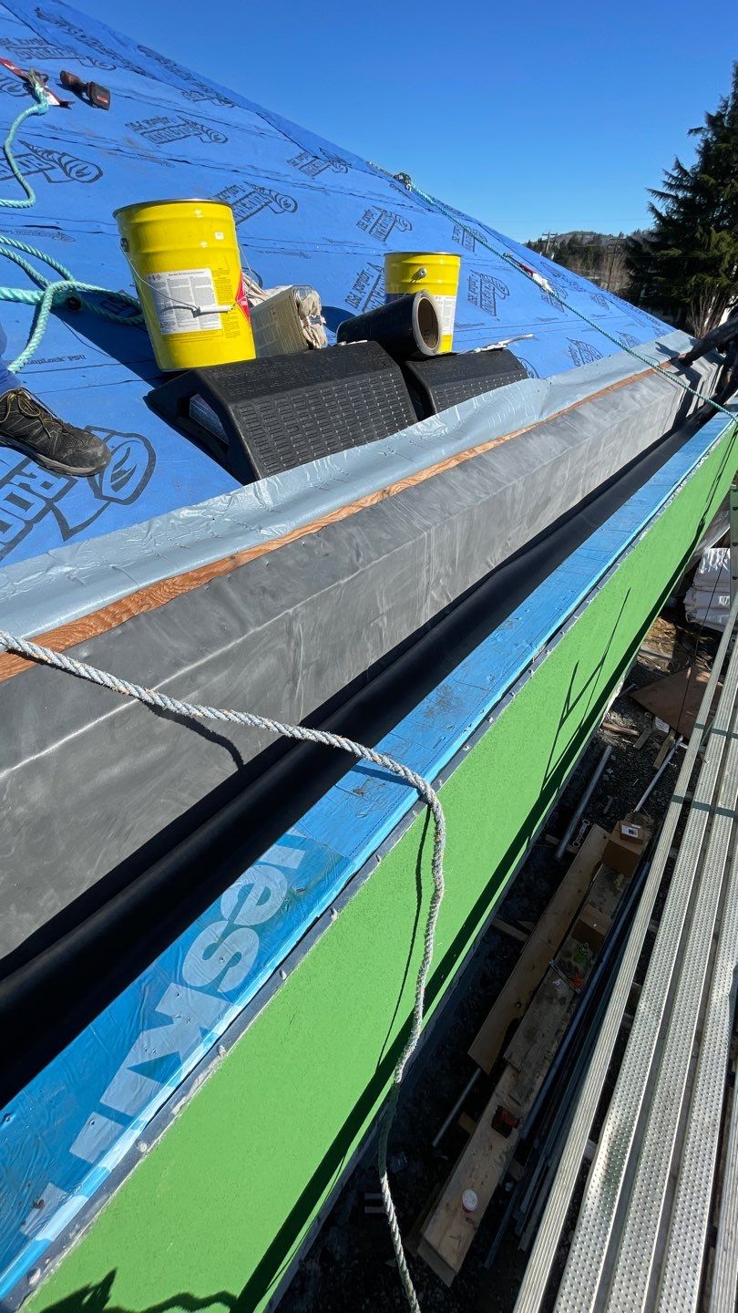 Commercial Roofing Installation using 12" Prolok metal and hidden gutters! by Top Notch Roofing Inc