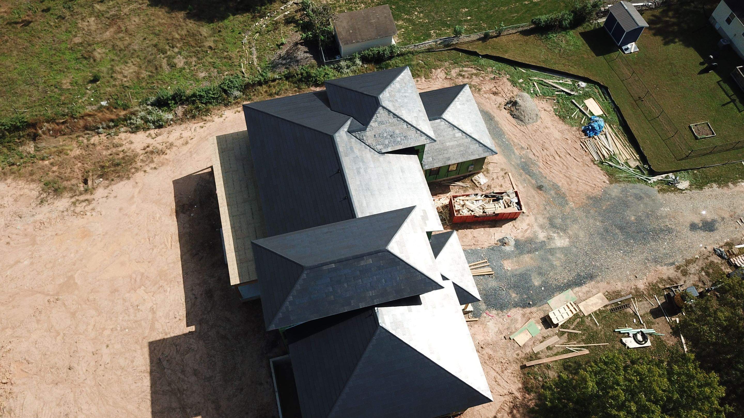 Tesla Solar Roof  using Tesla Solar Roof V3 tiles by American Home Contractors